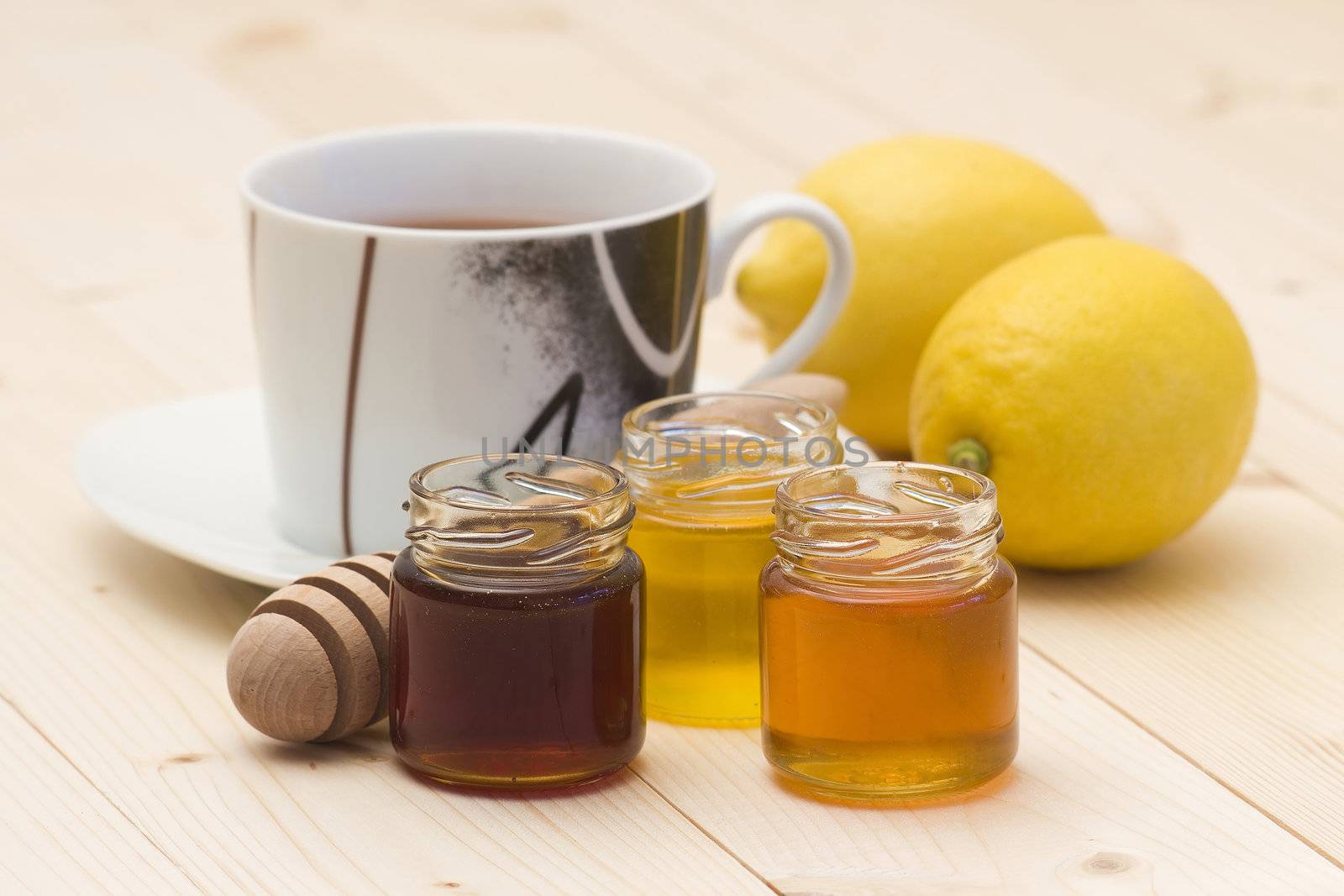 cup of tea, honey and fresh lemons
