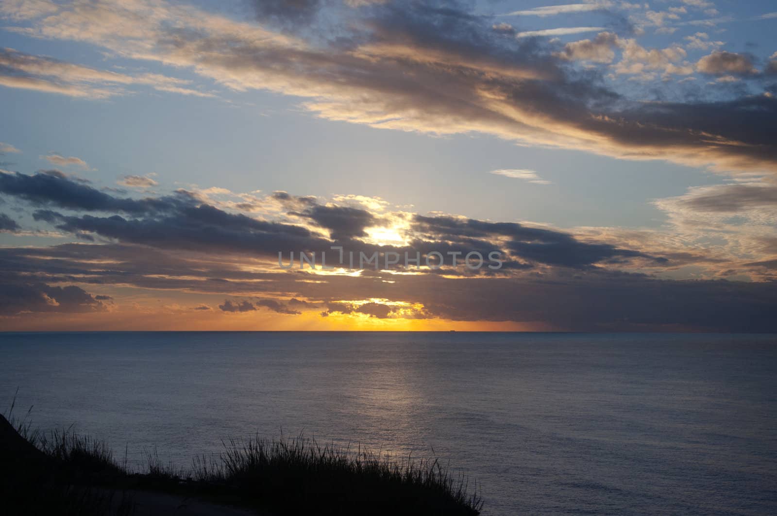 Portugal sunset by the ocean shot from the mountains