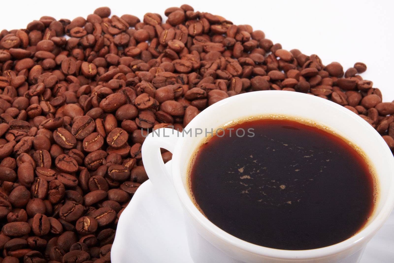 Coffee cup on coffee beans background