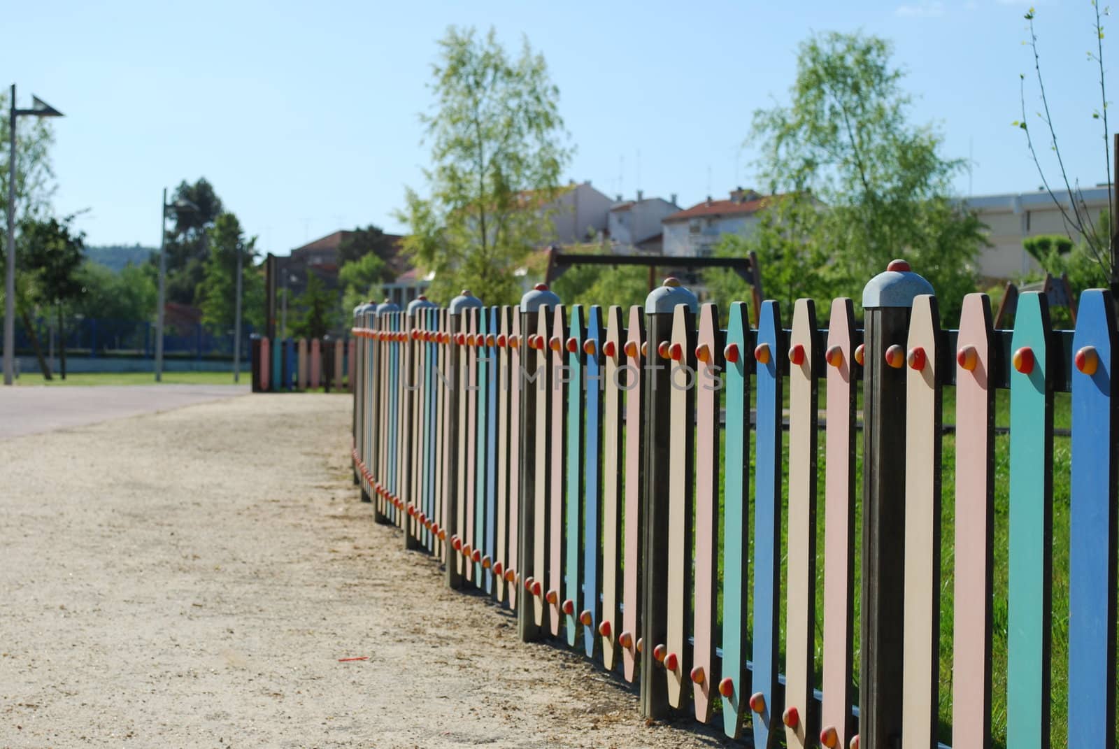 Colored fence on a park by luissantos84