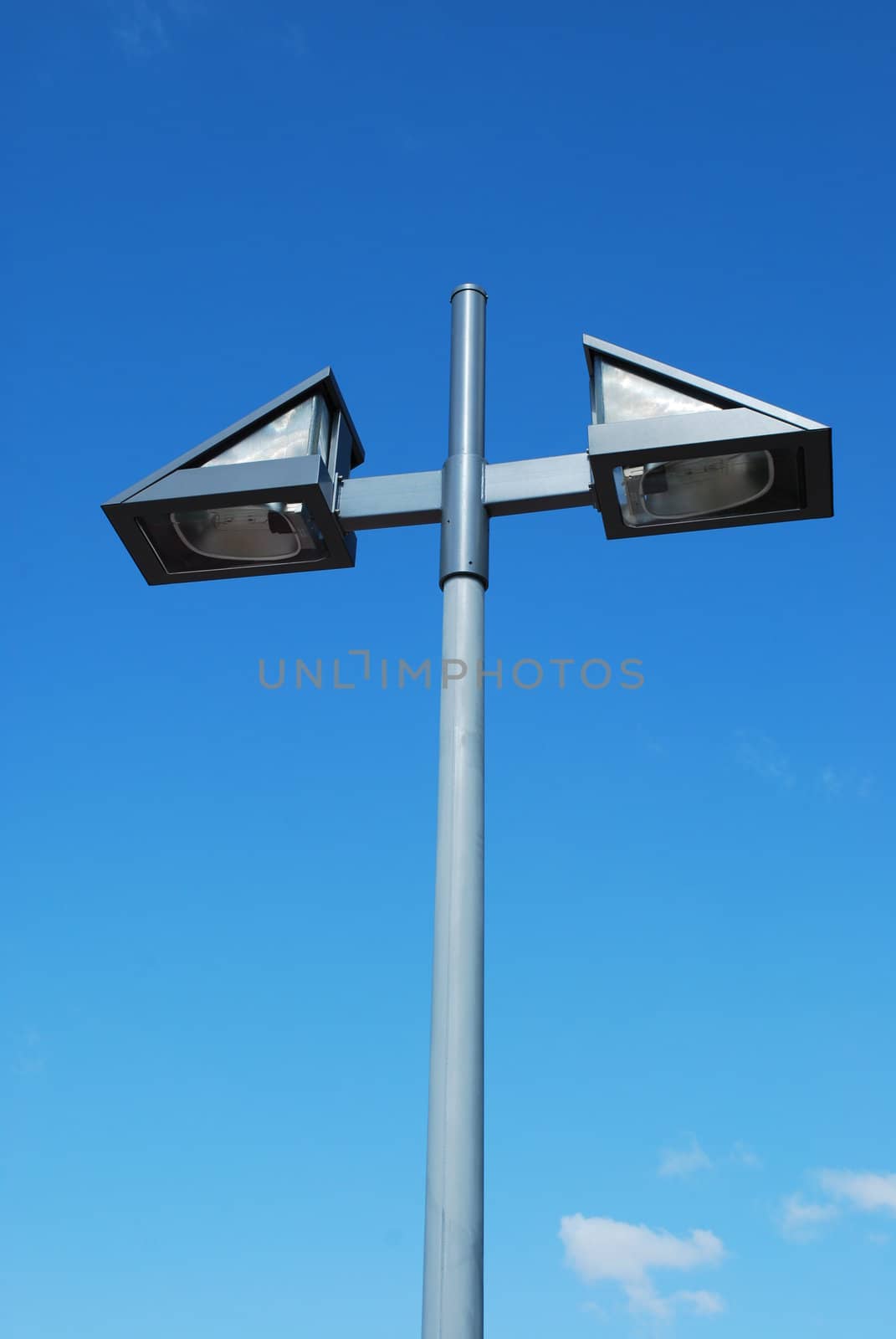 Modern street lamp with blue sky background by luissantos84