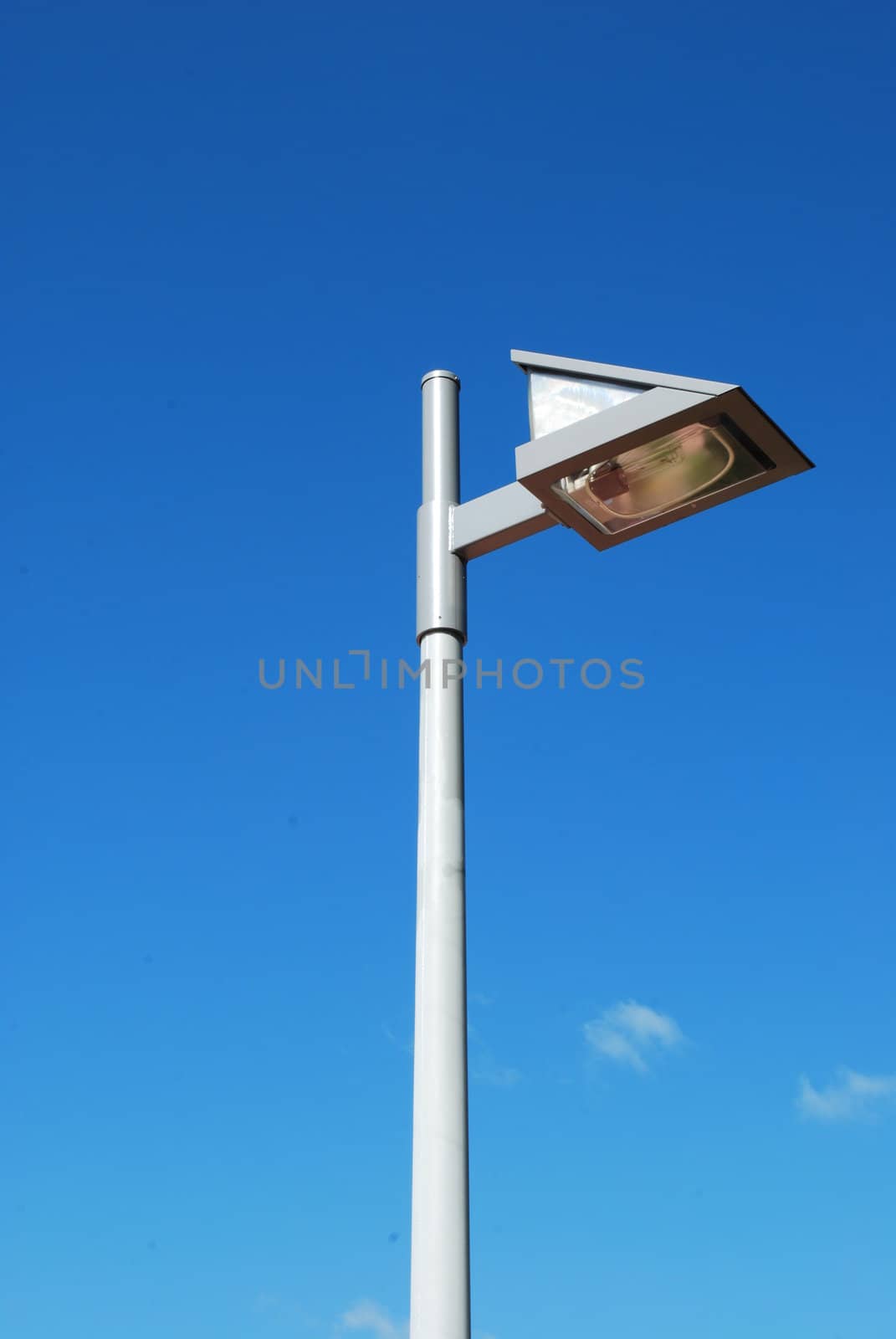 Modern street lamp with blue sky background by luissantos84