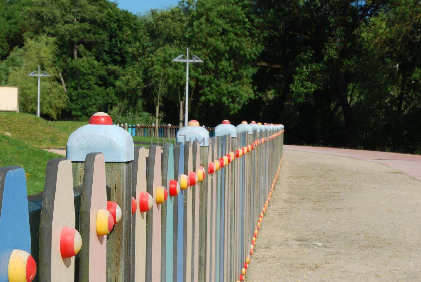 Colored fence on a park by luissantos84