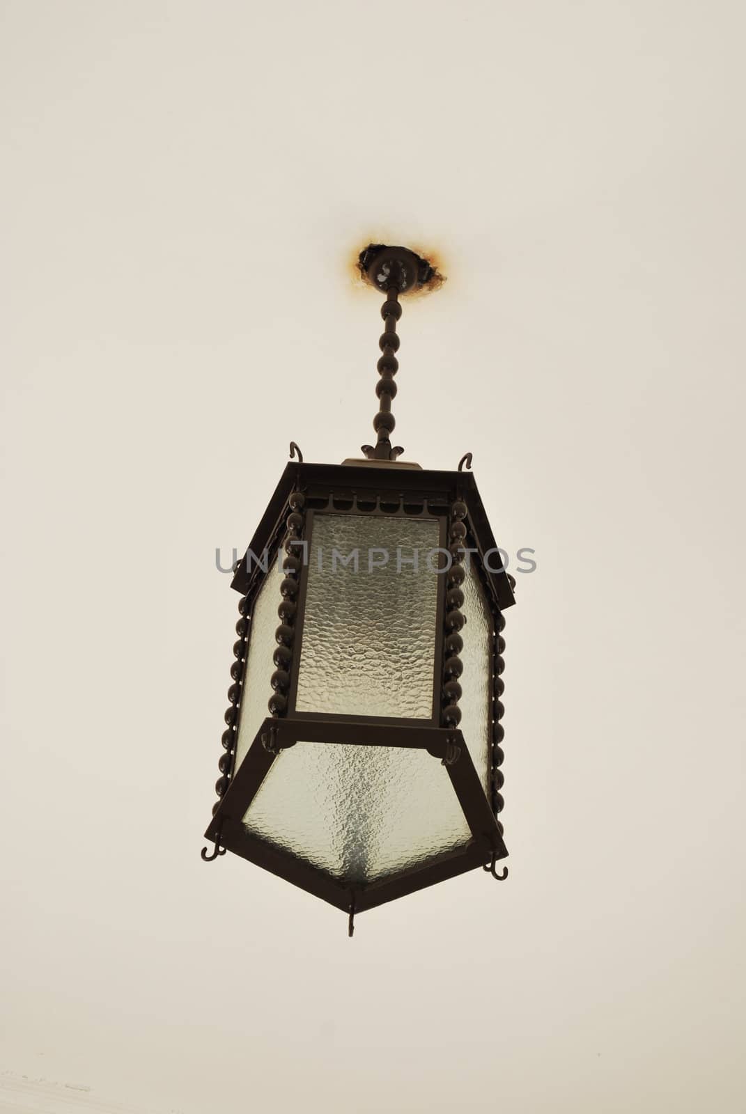 vintage and retro lamp hanging on a white wall