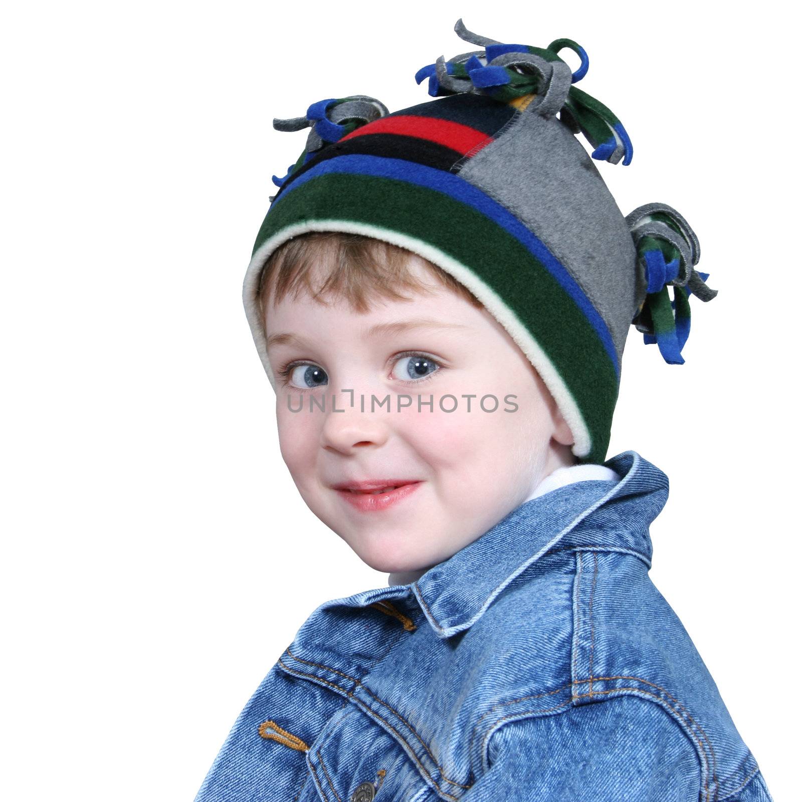 Four year old boy in crazy looking winter cap and a denim jacket.  Shot with the Canon 20D.