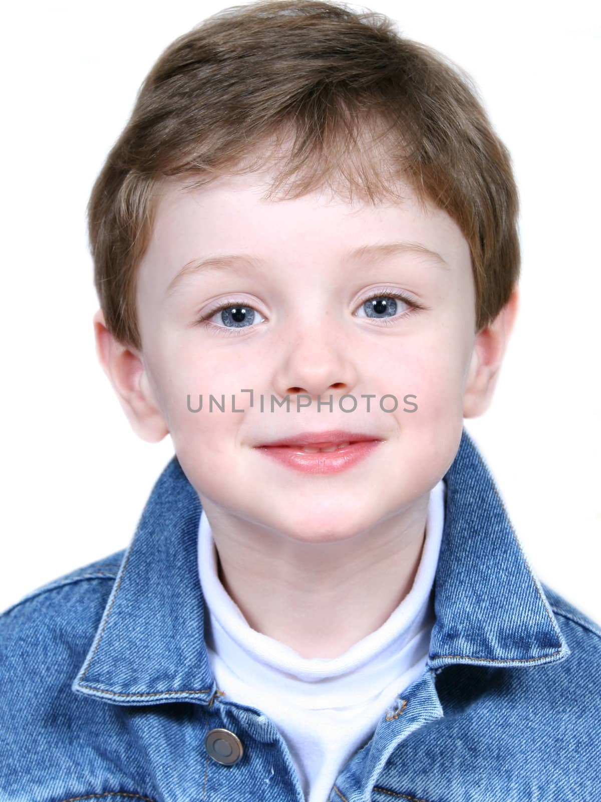 Portrait of boy in denim jacket over white background. Shot with the Canon 20D.