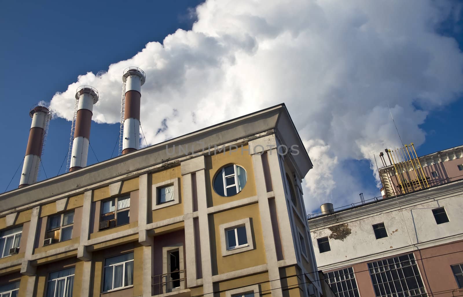 Pipe plant emit harmful substances. Against the blue sky. Industrial landscape.