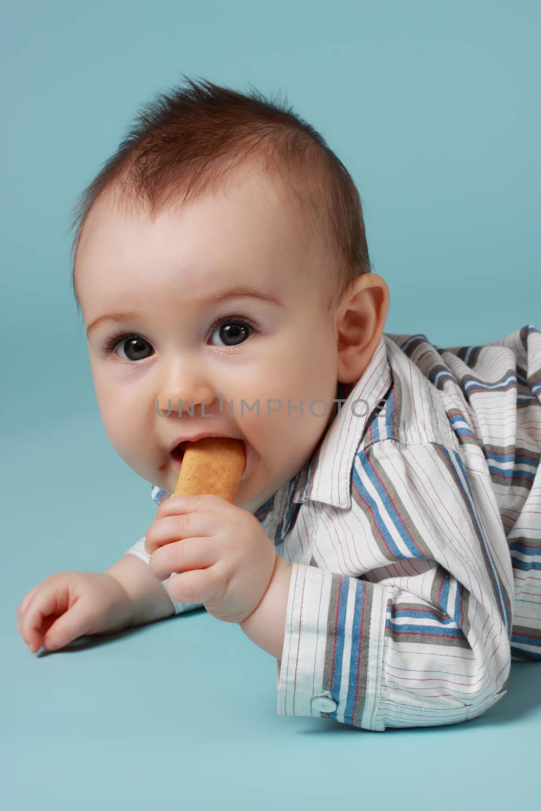 baby boy eating a cookie by lanalanglois