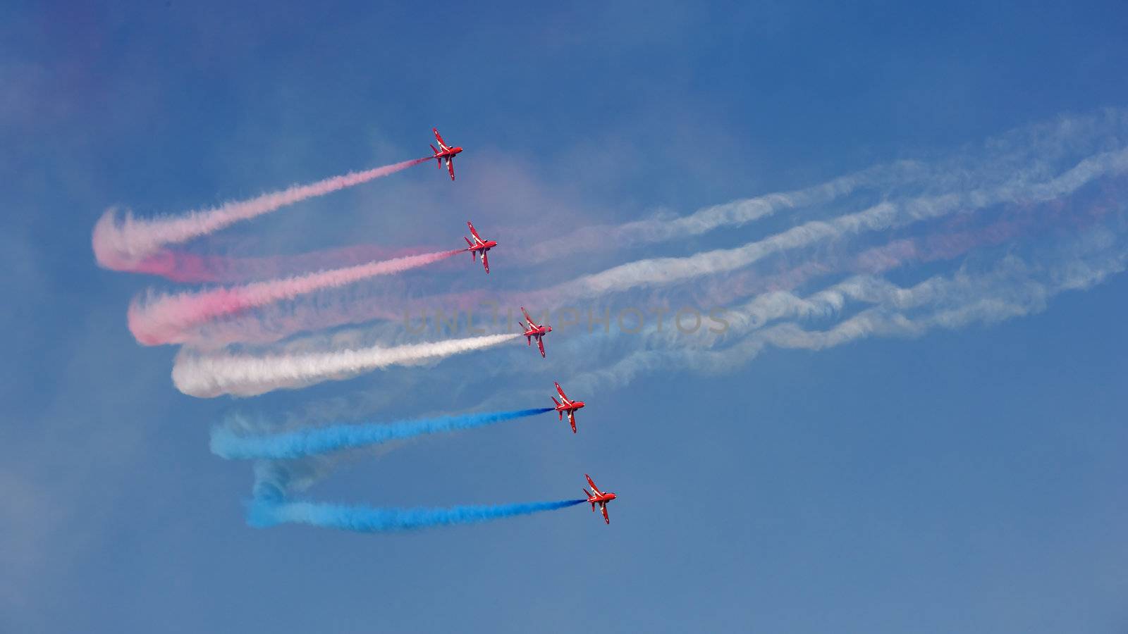 The Royal Air Force's Red Arrows team perform in their BAE Hawk aircraft at the Dubai Airshow in the United Arab Emirates.