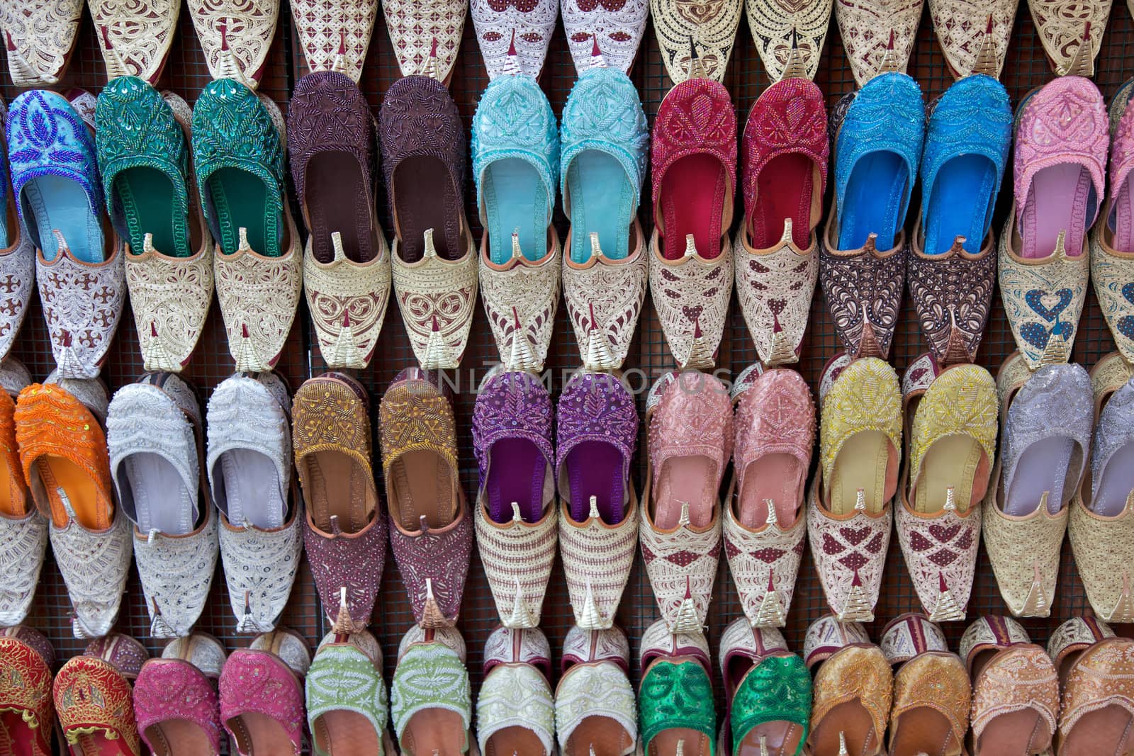 Arabian shoes on sale in a traditional souk in old Dubai, UAE.