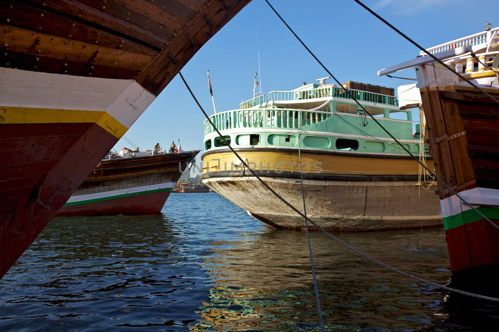 Traditional wooden trading dhows moored in Dubai Creek, UAE.