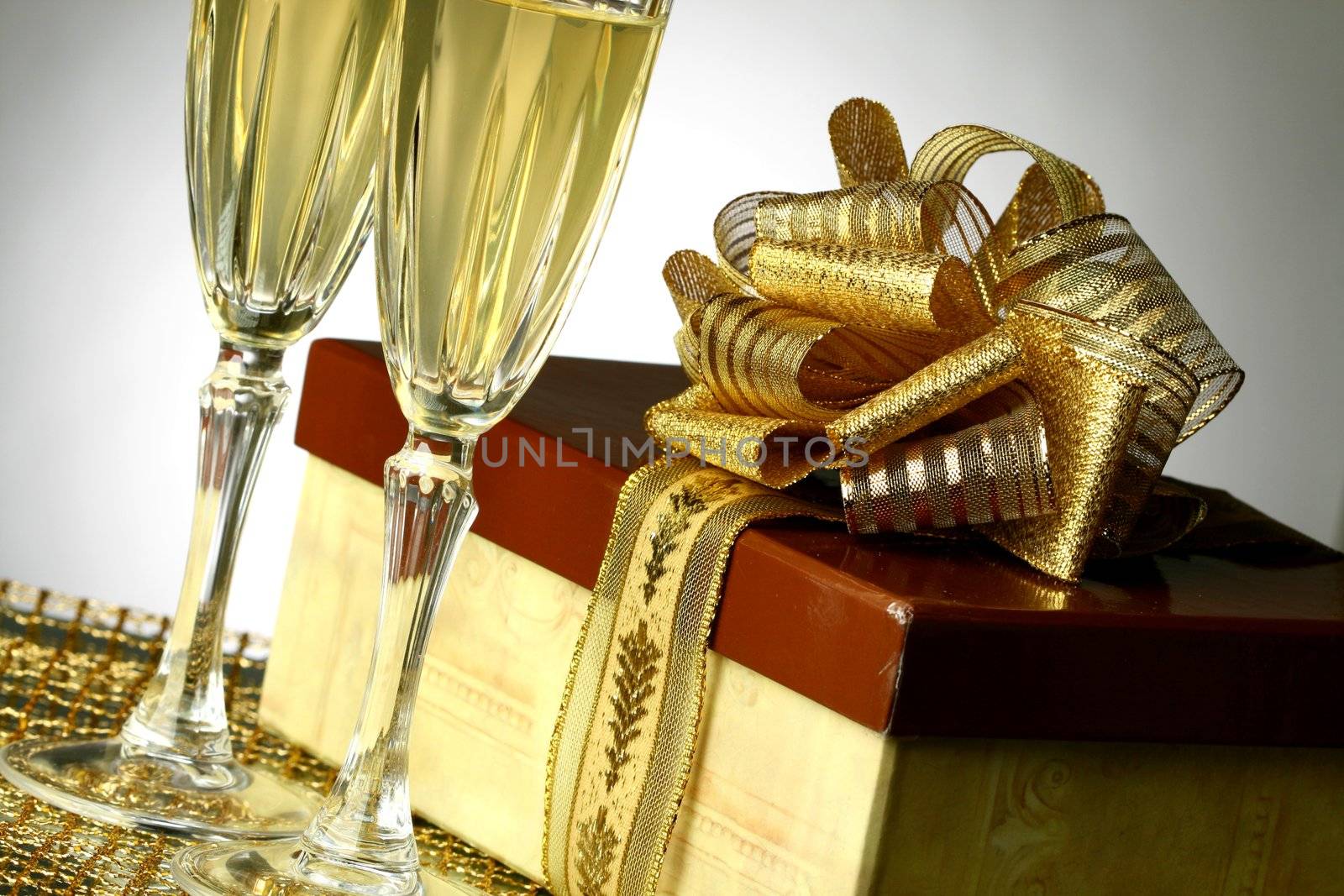 holiday card golden champagne and gift