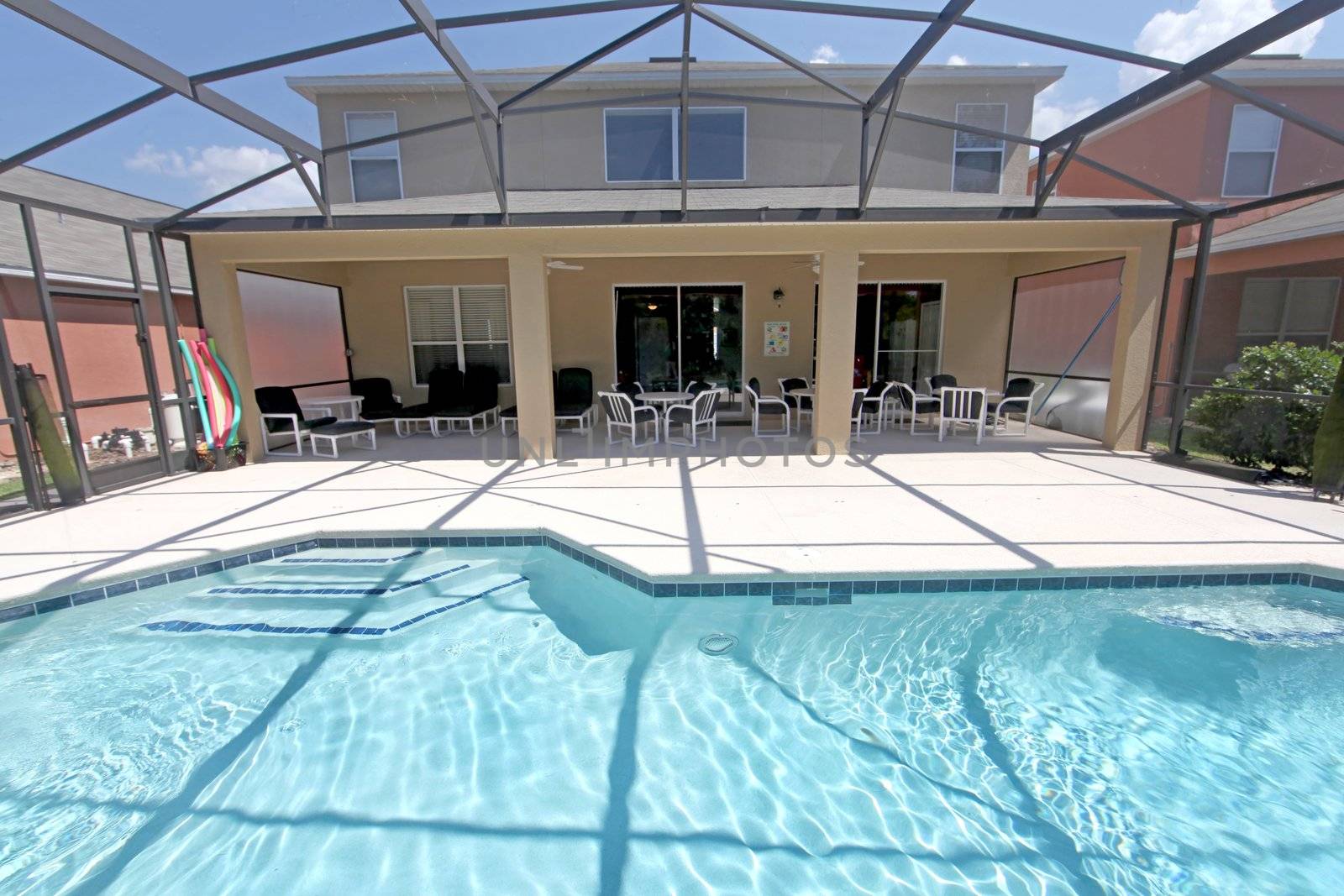 A Back Exterior of a Florida Home with Pool and Lanai