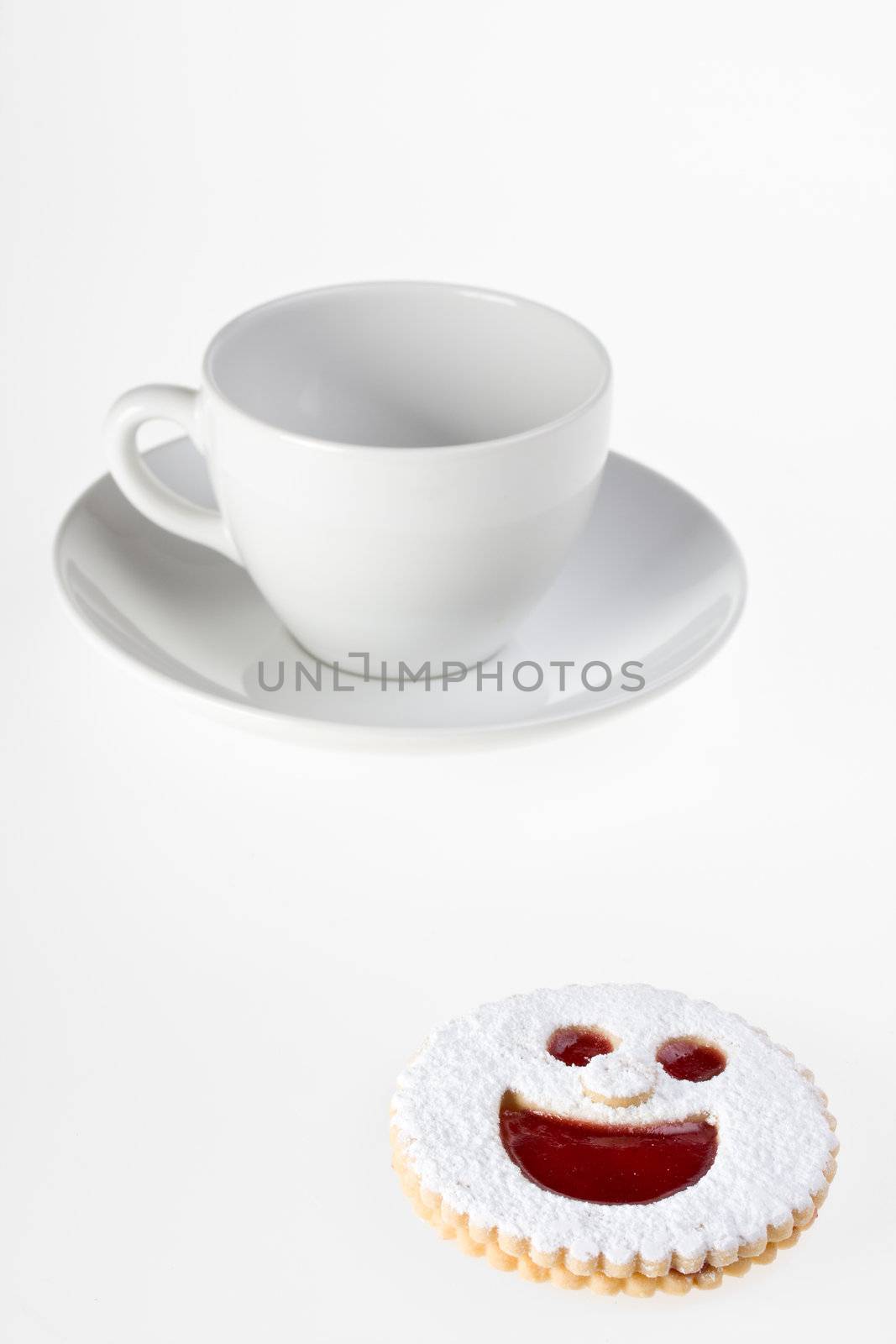 smiling cookie and a coffee cup isolated on white background by bernjuer