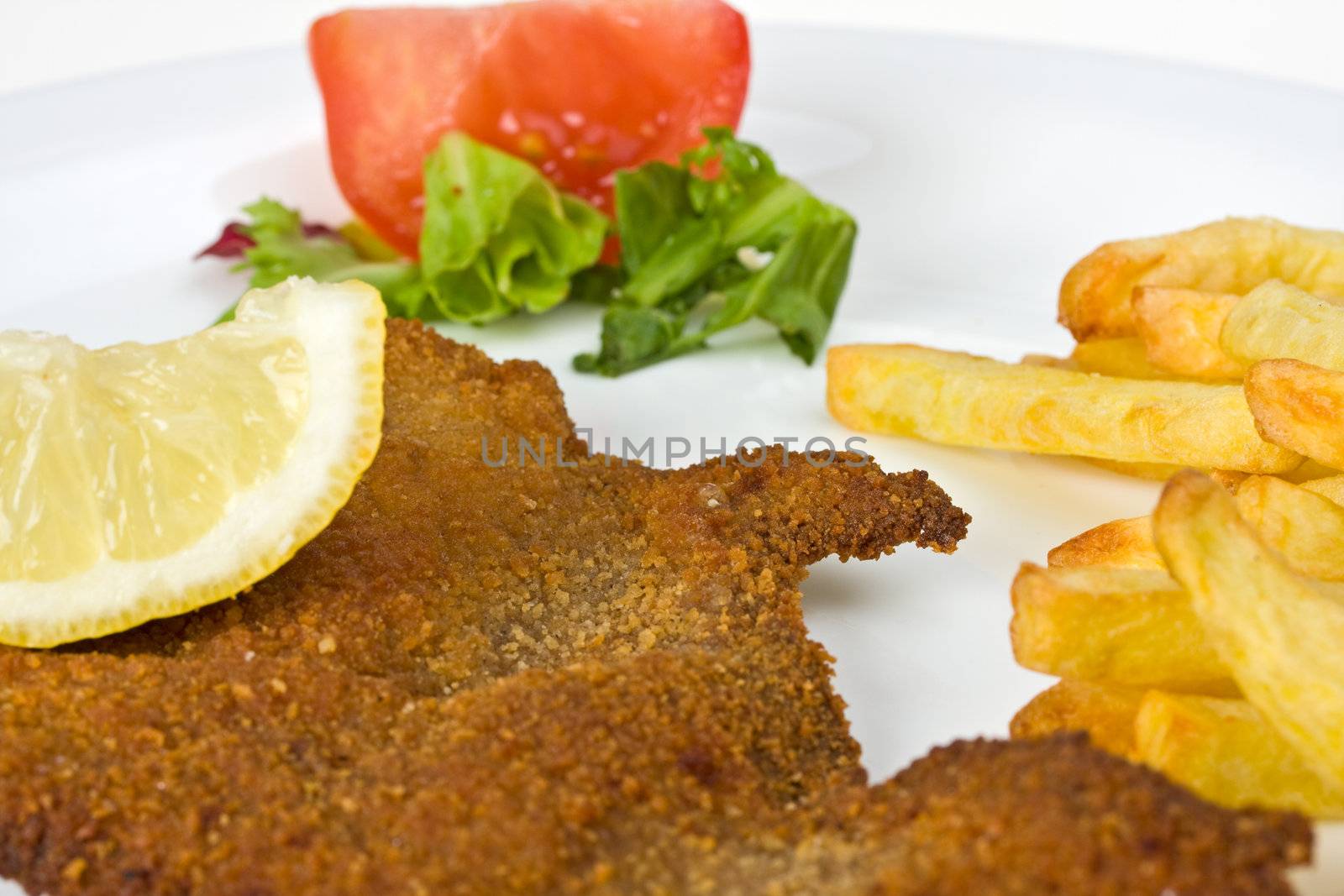 detail of a viennese schnitzel on a plate