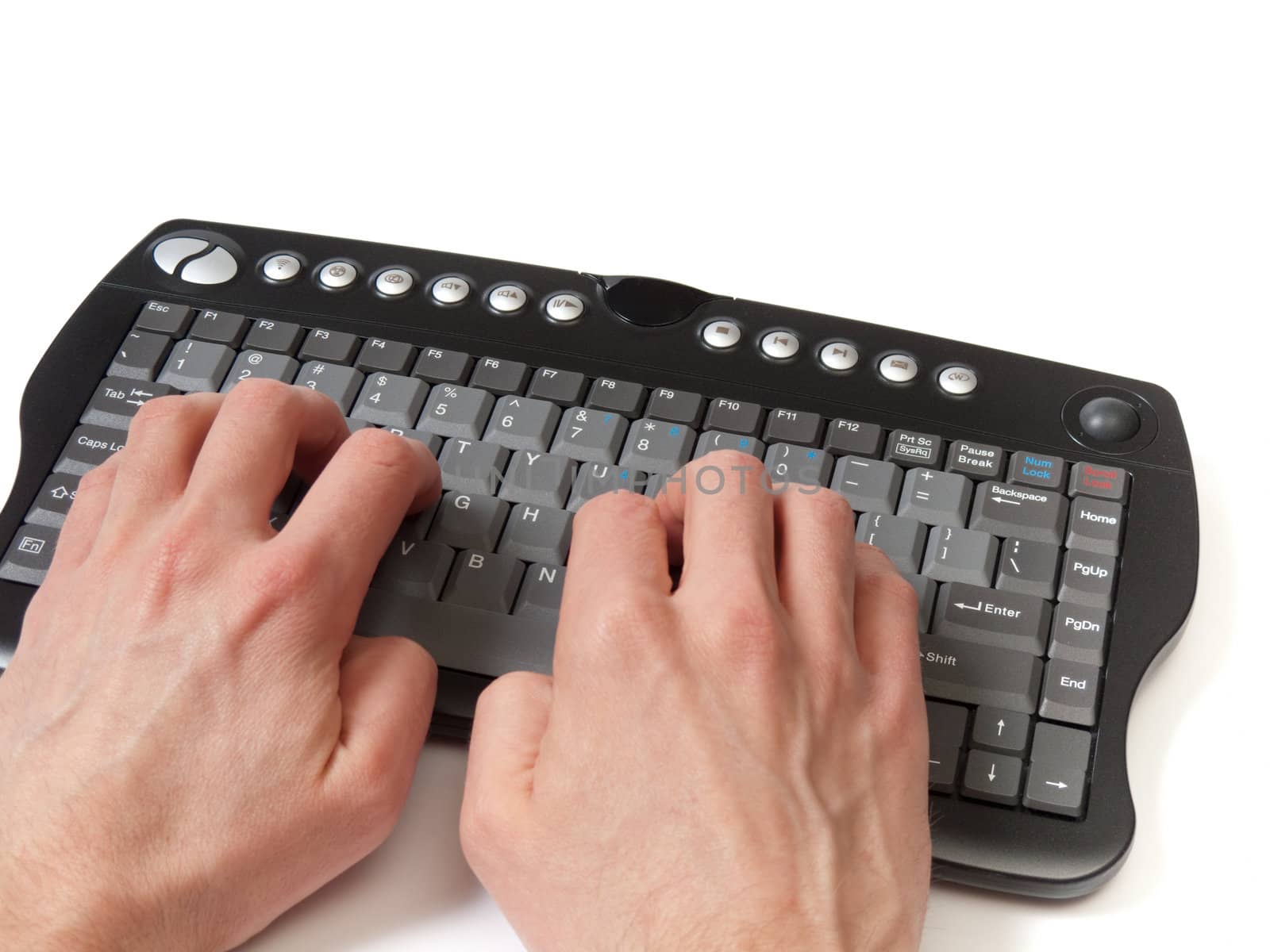 Hands in front of a compact black keyboard, on the home row, isolated on white.