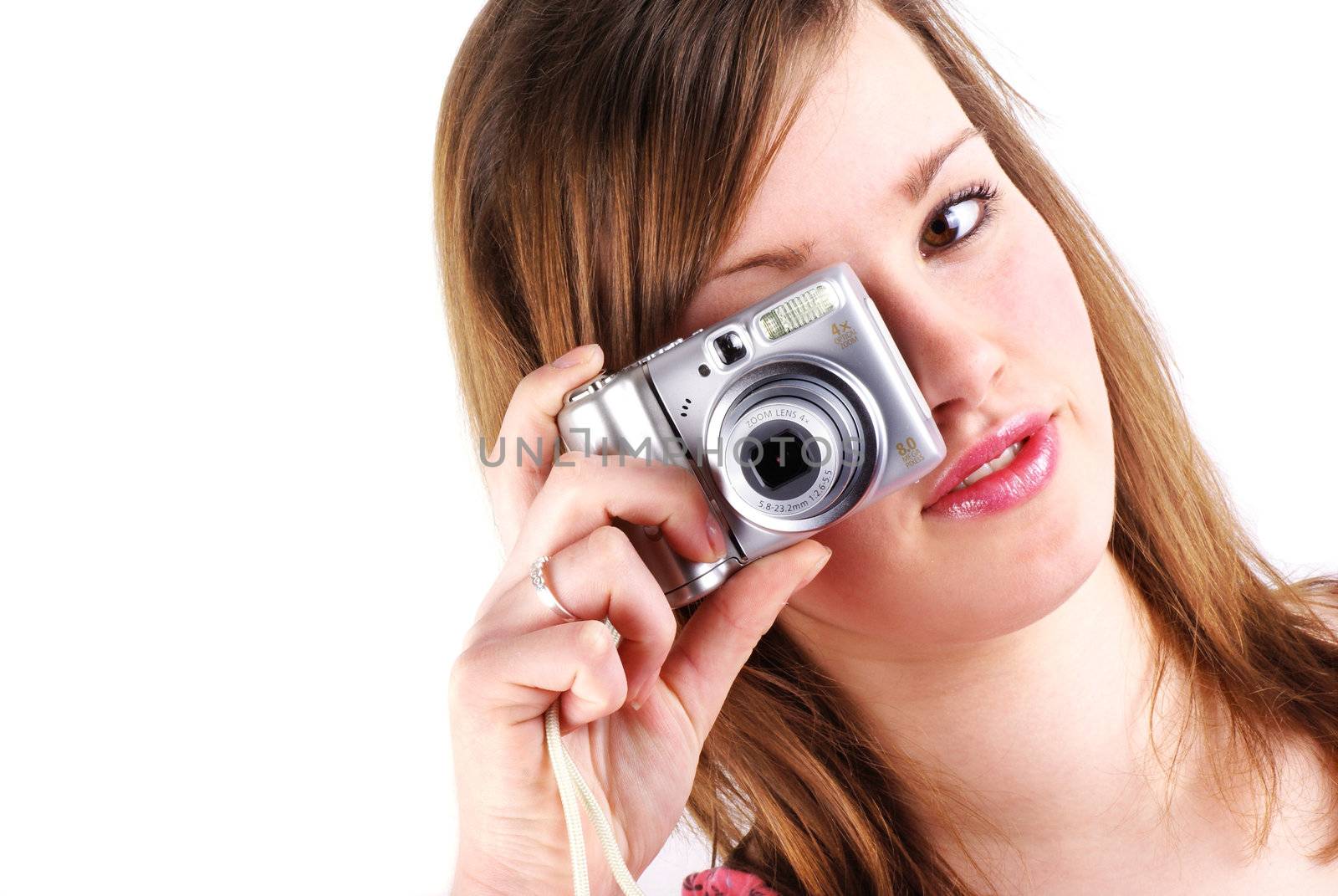 Teen girl with compact camera isolated on white with copy space.
