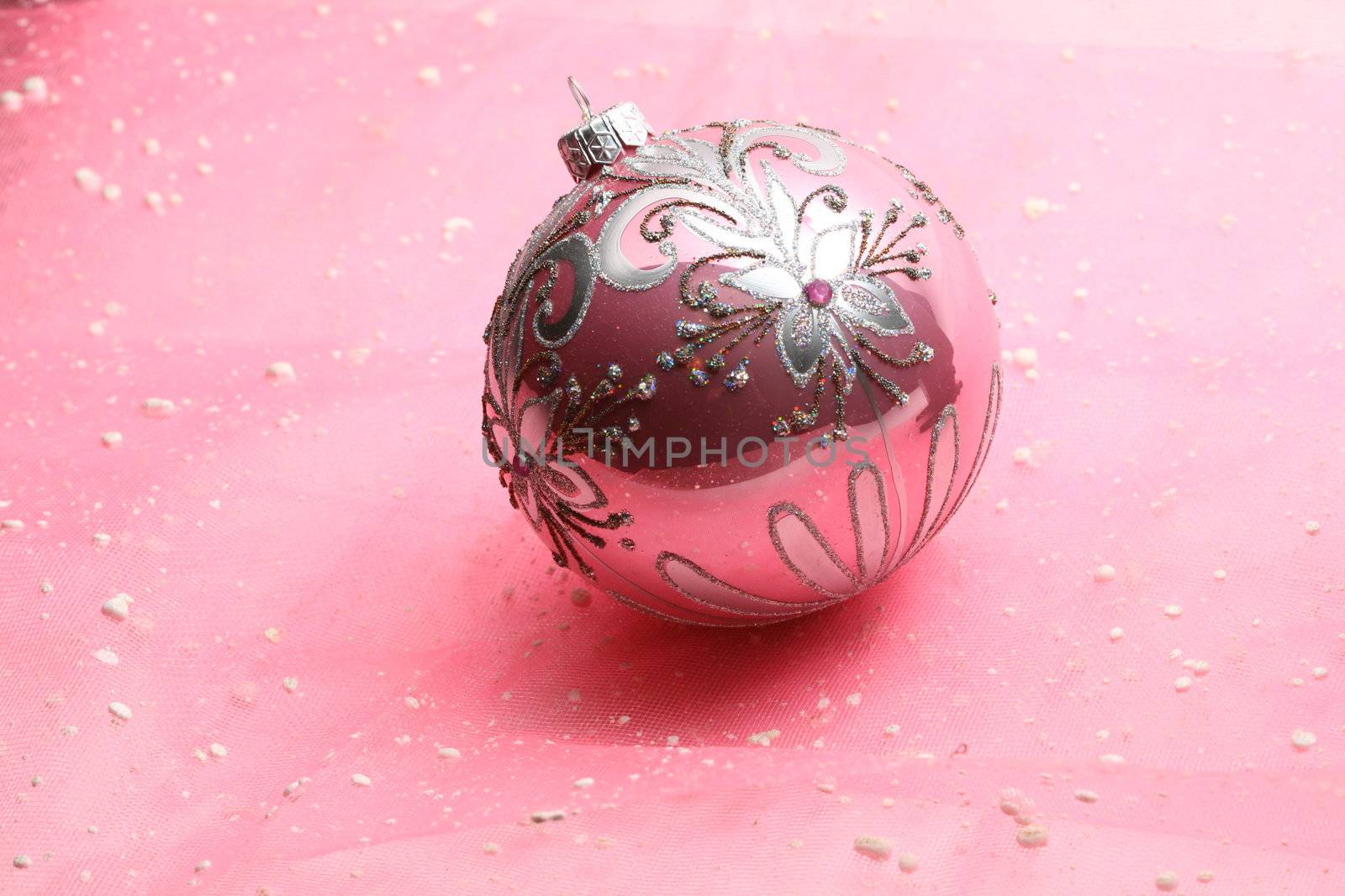 christmas card ball on pink background