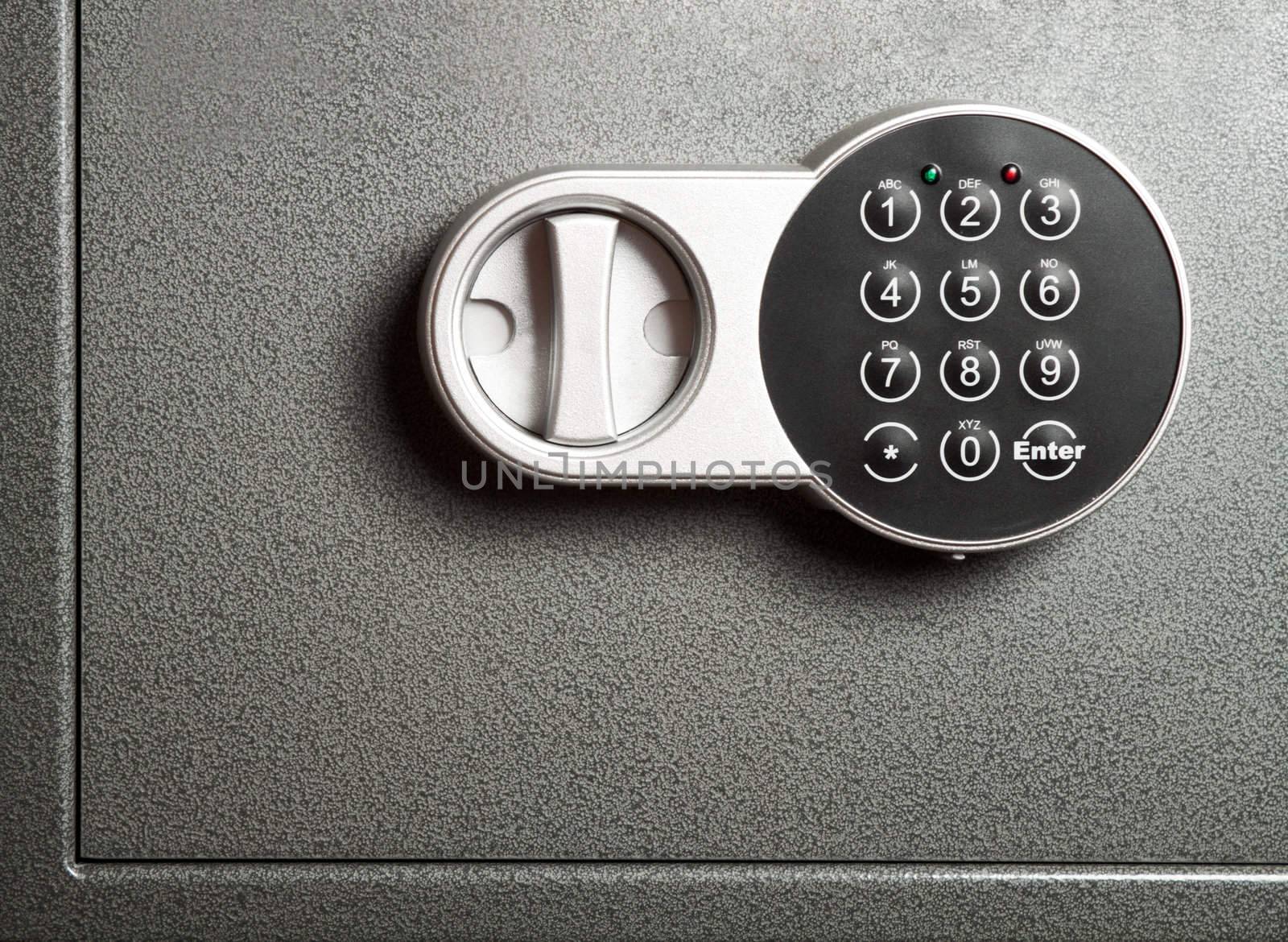 Close-up to steel safe door with electronic combinational lock