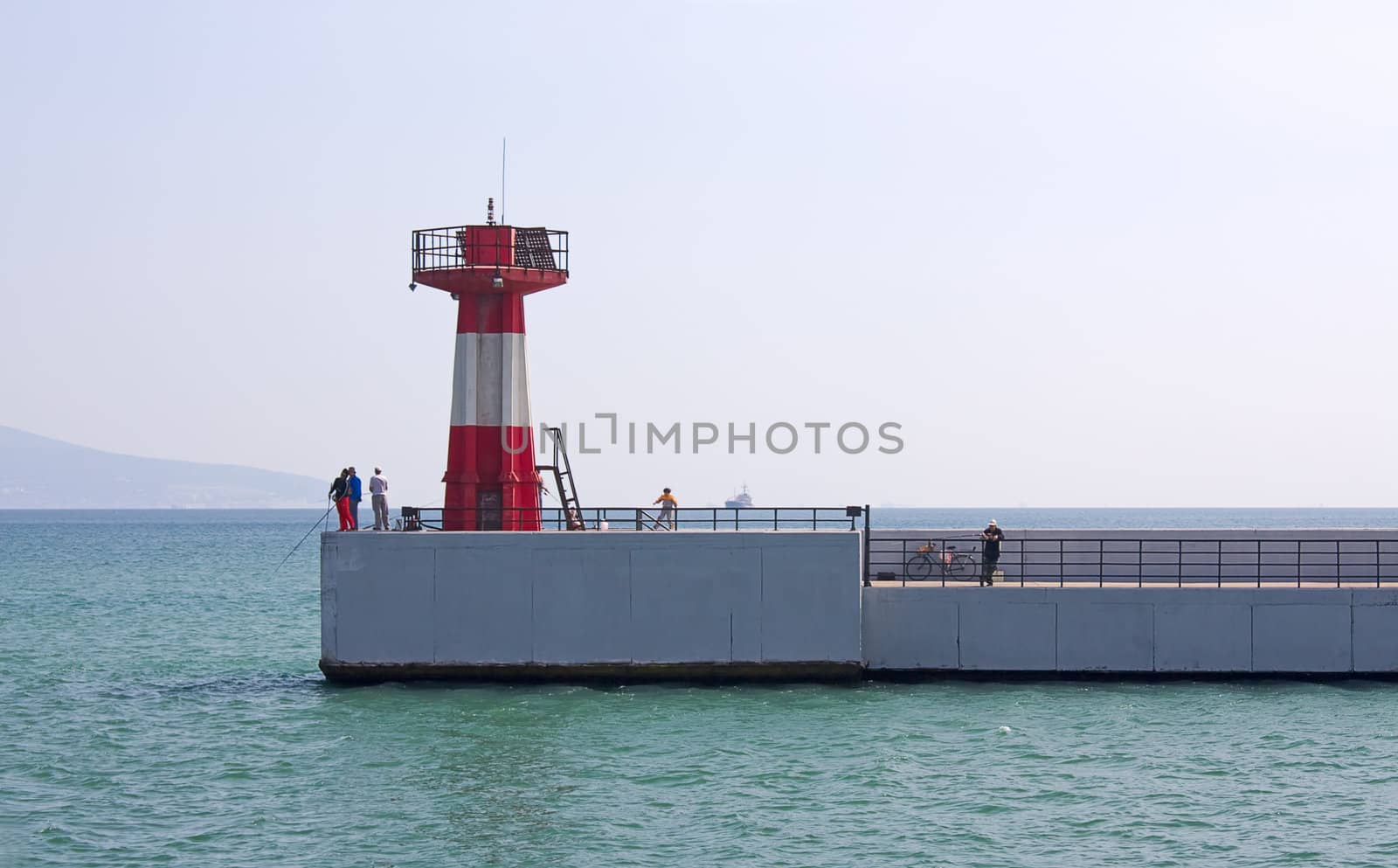 At entrance to port of lighthouse on shores of Black Sea, Novorossiysk, Russia.