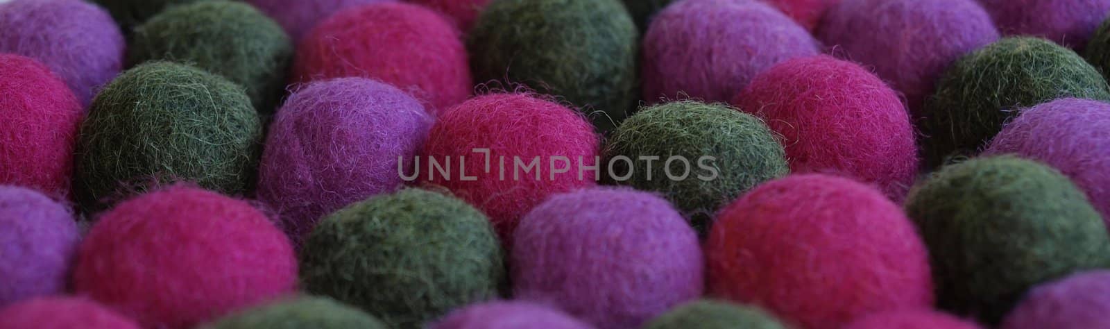 Felted wool ball necklace background