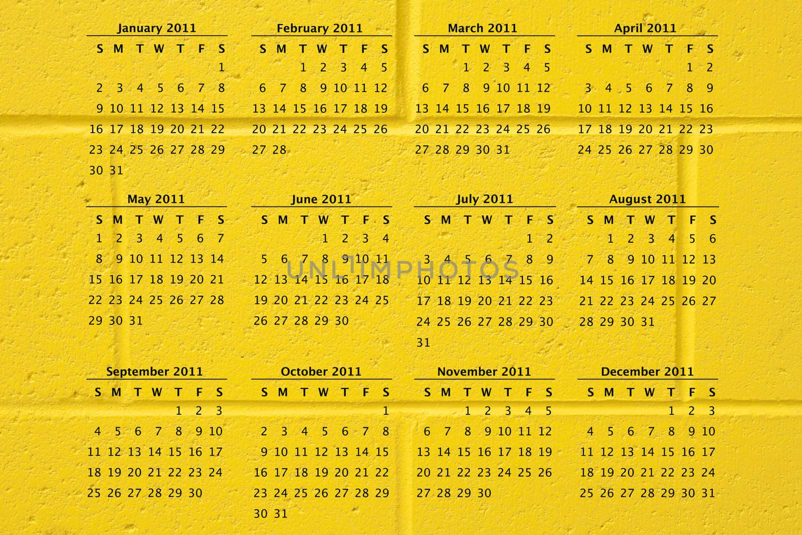 2011 calendar on fun school yellow cement block wall background, great texture.