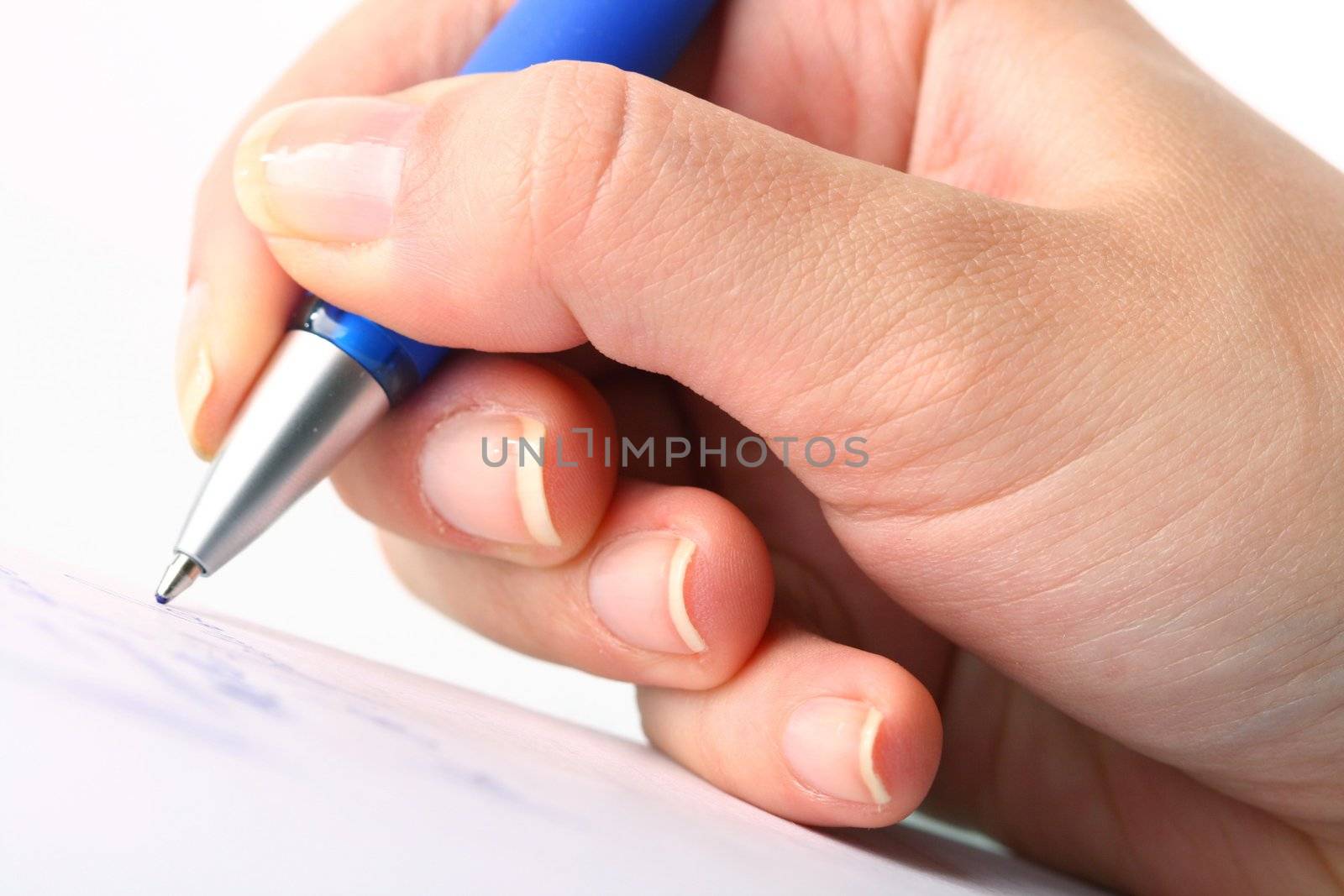 girl write on white paper close up