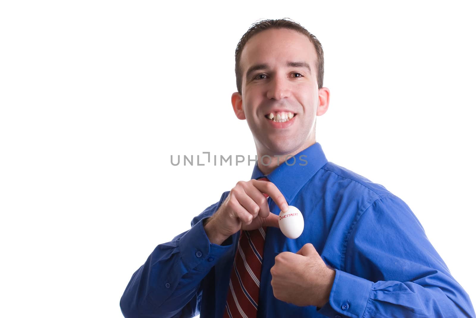 Concept image of a smiling businessman depositing his savings, using an egg as a metaphor, all isolated against a white background