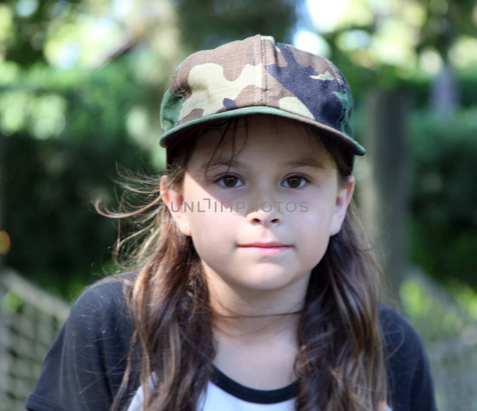 Camouflage hat on a young girl