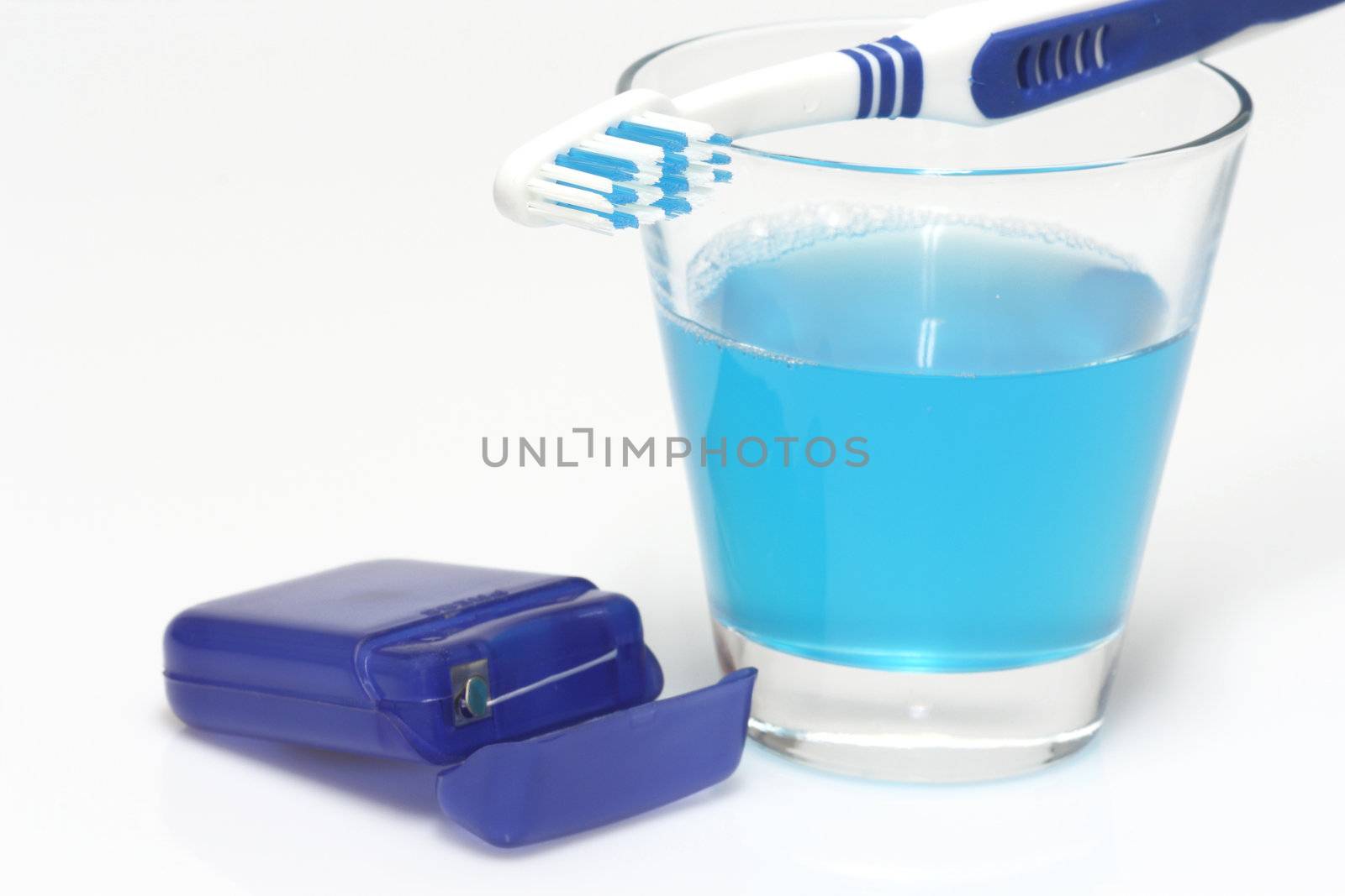 Dental care products on bright background