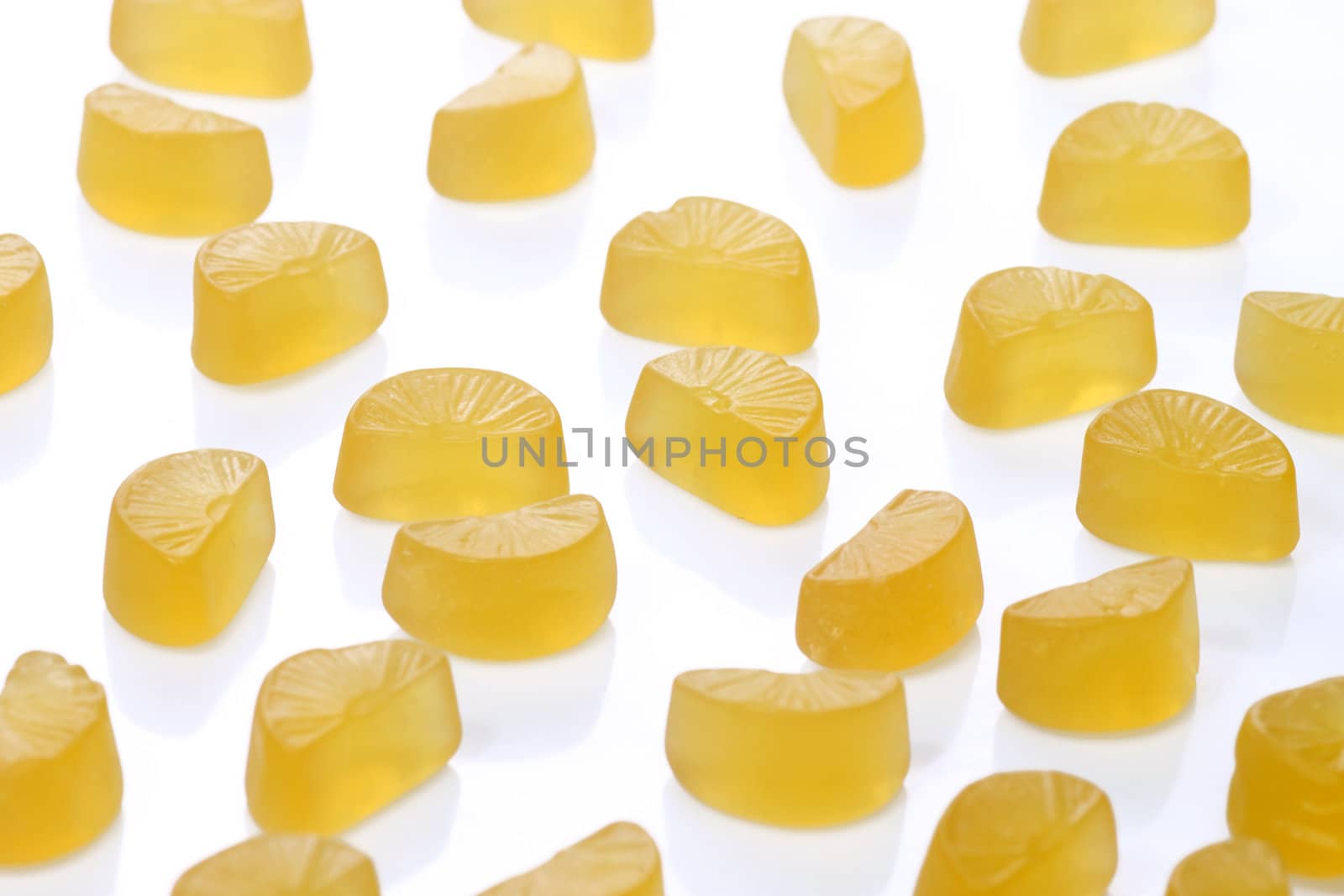 Brightly coloured wine gums on bright background