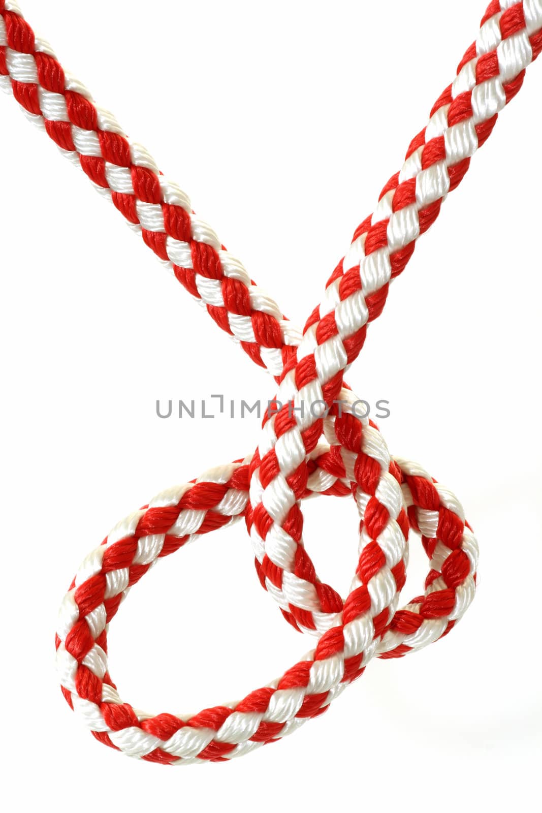 Rope with knot close up. Isolated on white background.