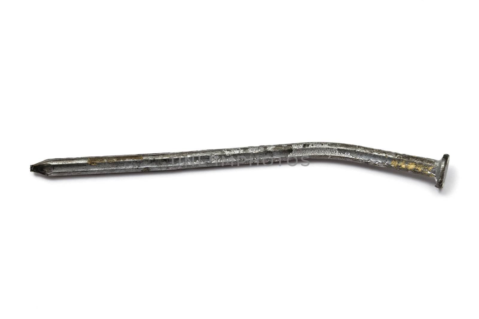 Rusty bent nail isolated on white background