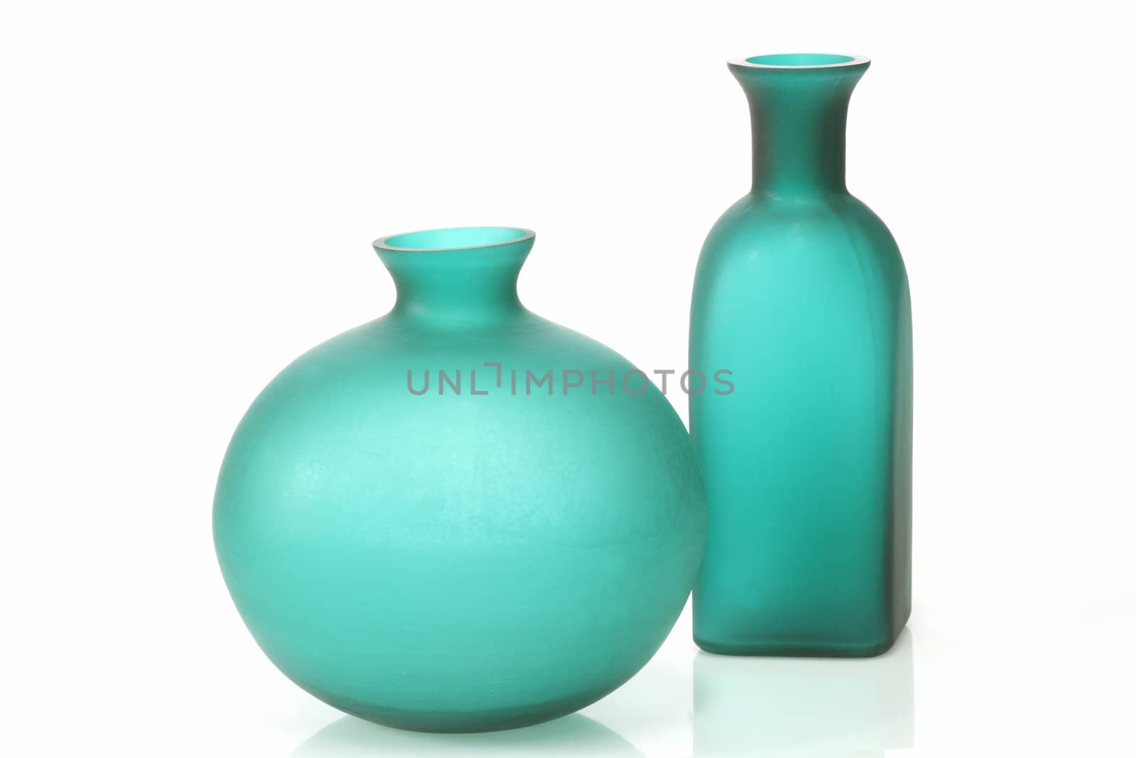 Modern green vases on bright background