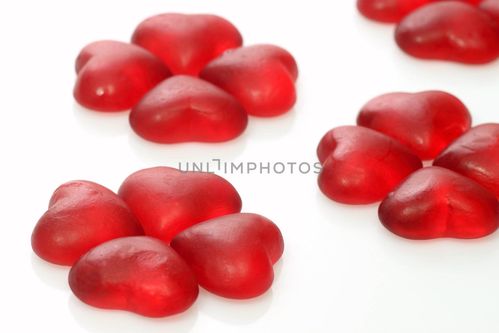 Brightly coloured wine gums on bright background