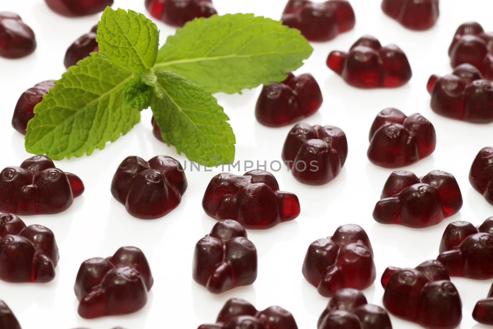 Brightly coloured wine gums on bright background