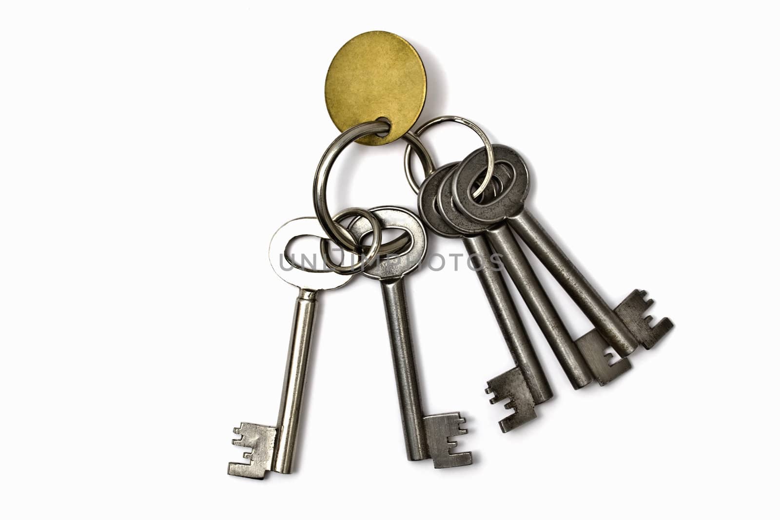 A bunch of old keys isolated on white background 
