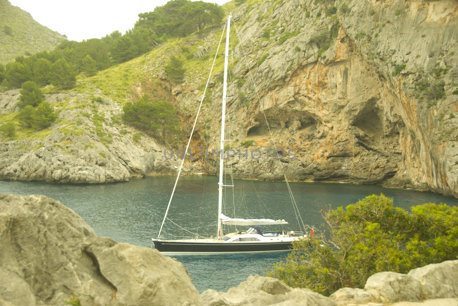 sailing boat in a lonley ocean bay in mallorca spain