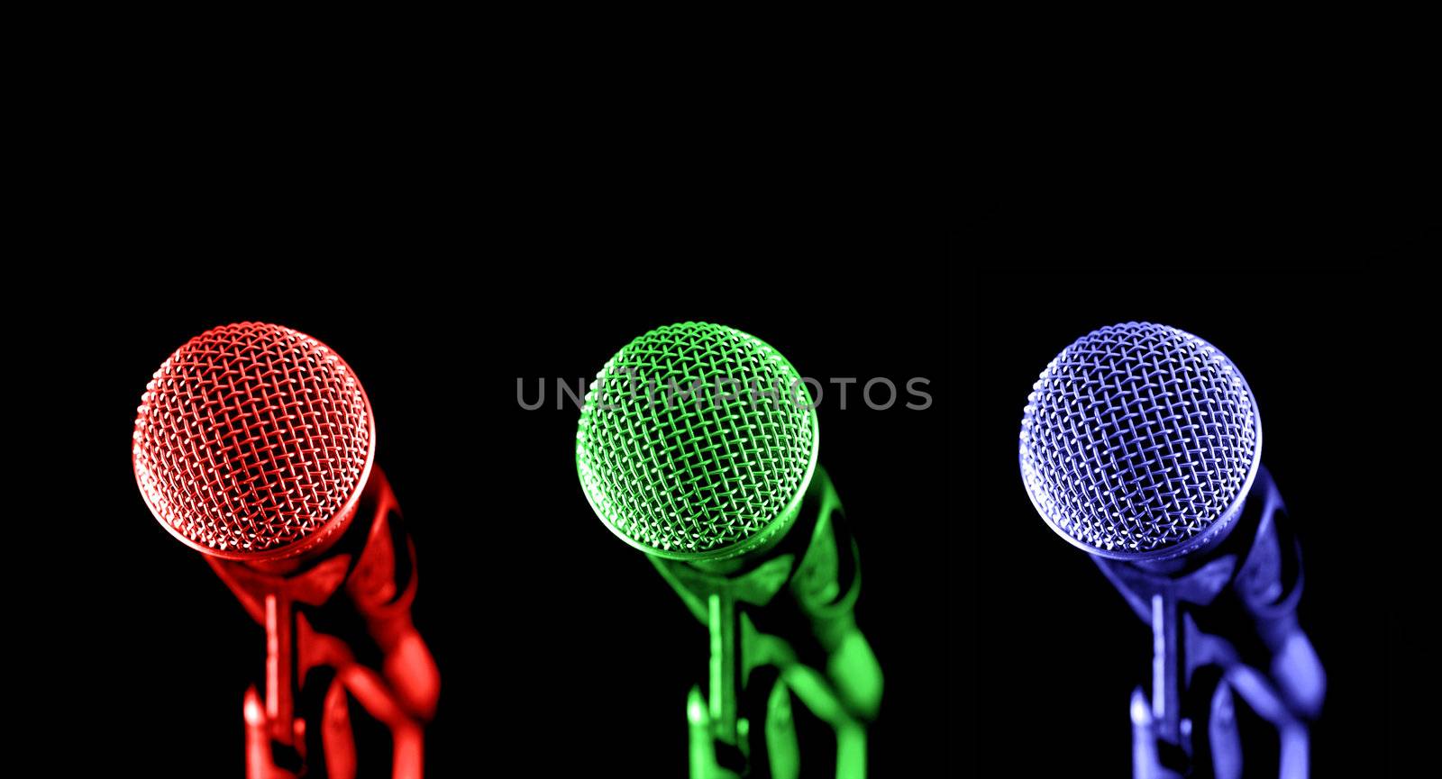 primary colored microphones on black