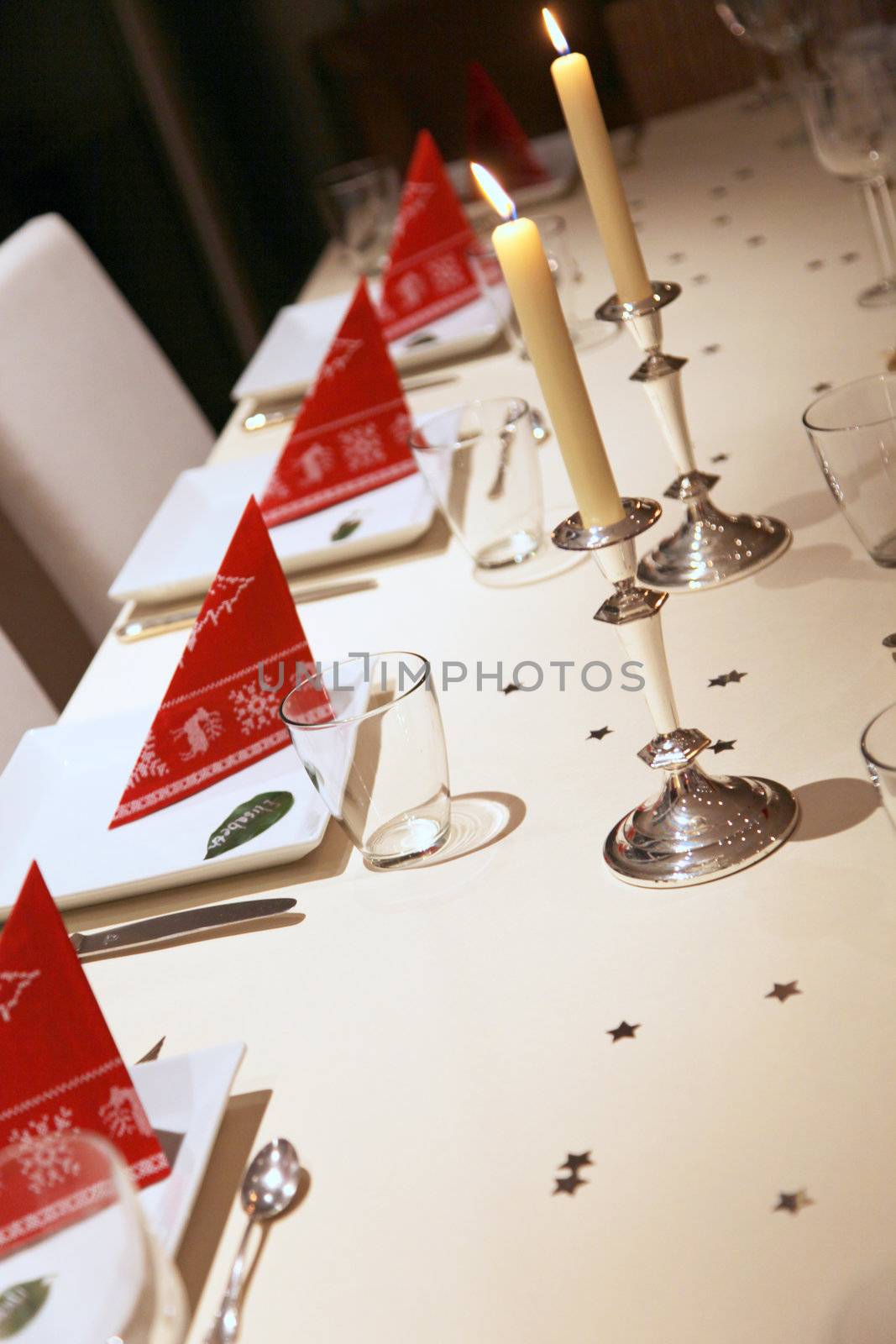 Christmas table decoration with stars and candles
