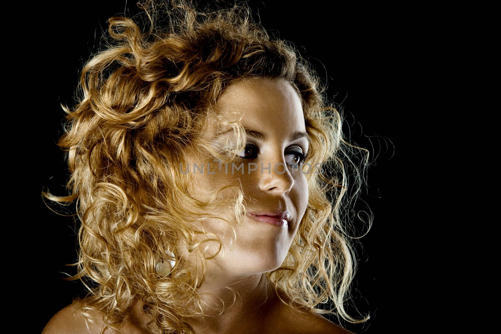 Beautiful woman portrait isolated on black background