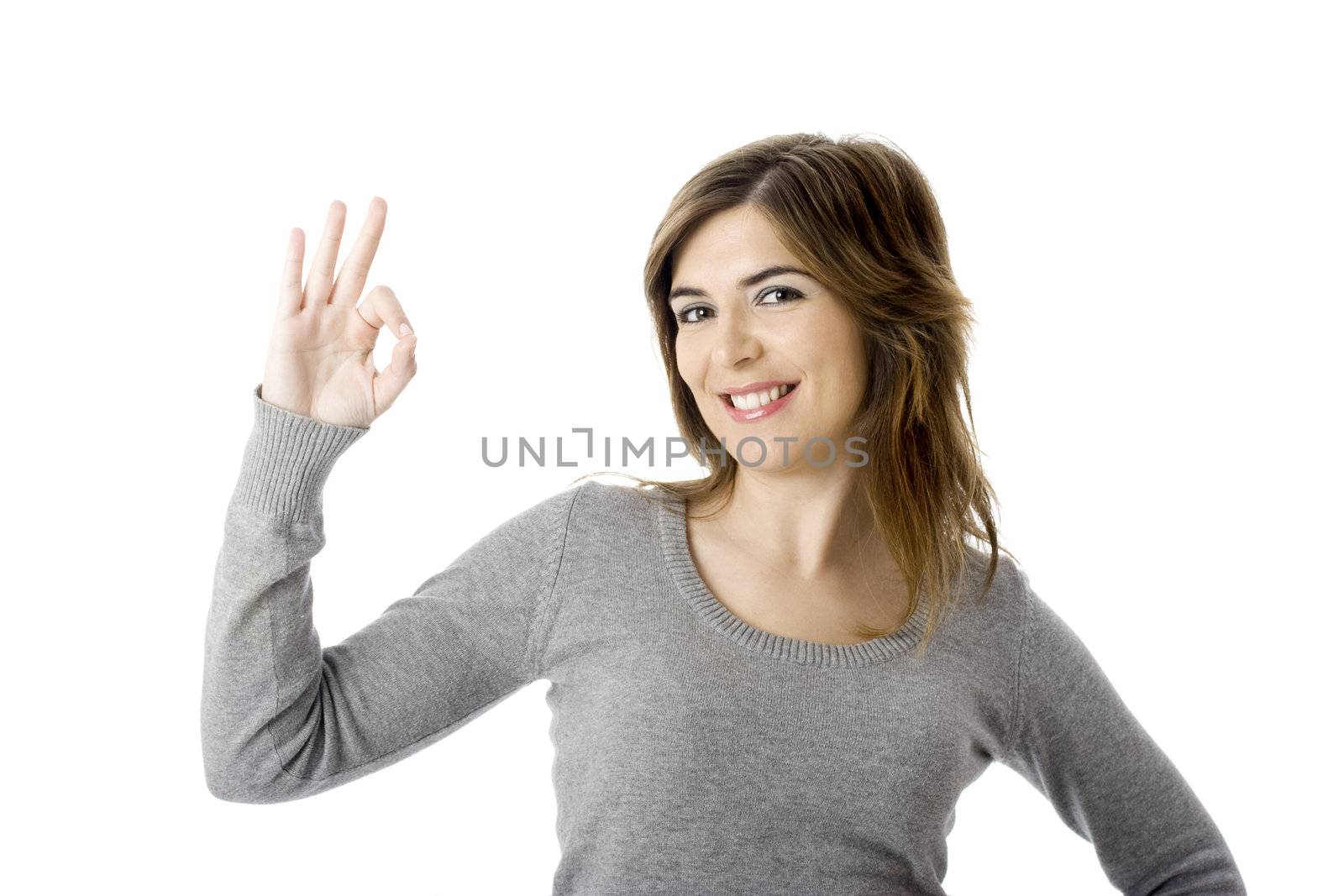 Young businesswoman indicating ok sign. Isolated over white background