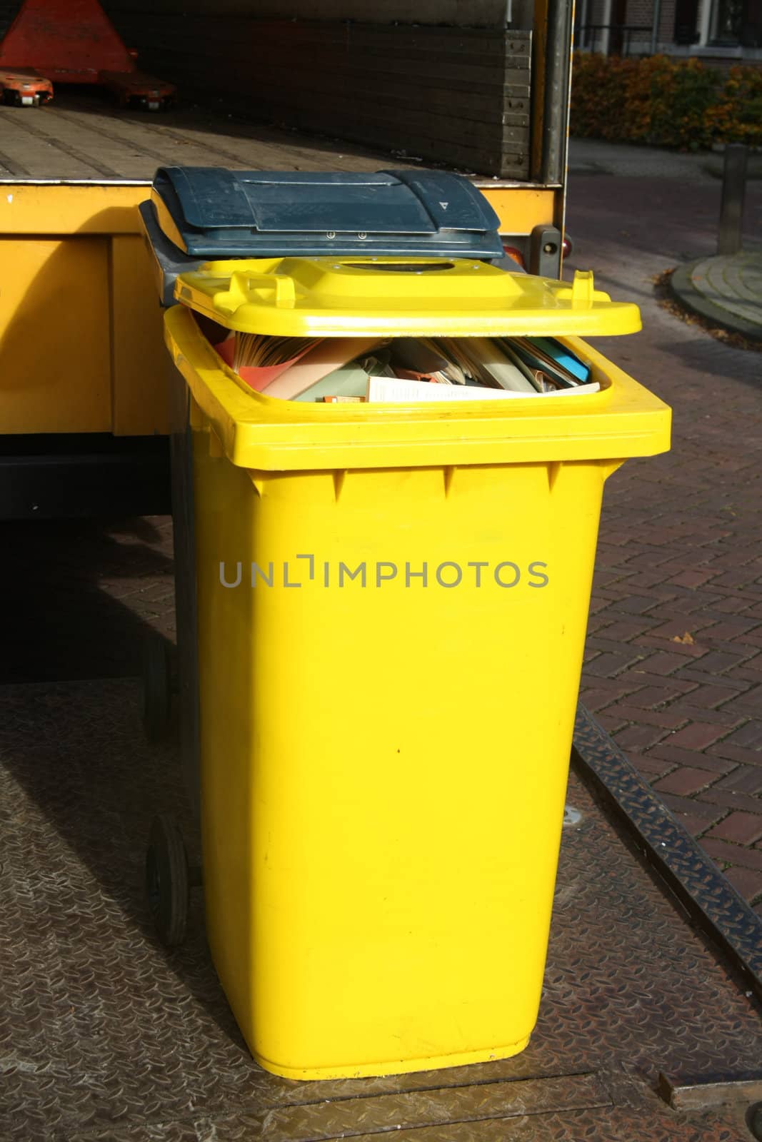 Big yellow container for environment friendly paper collection