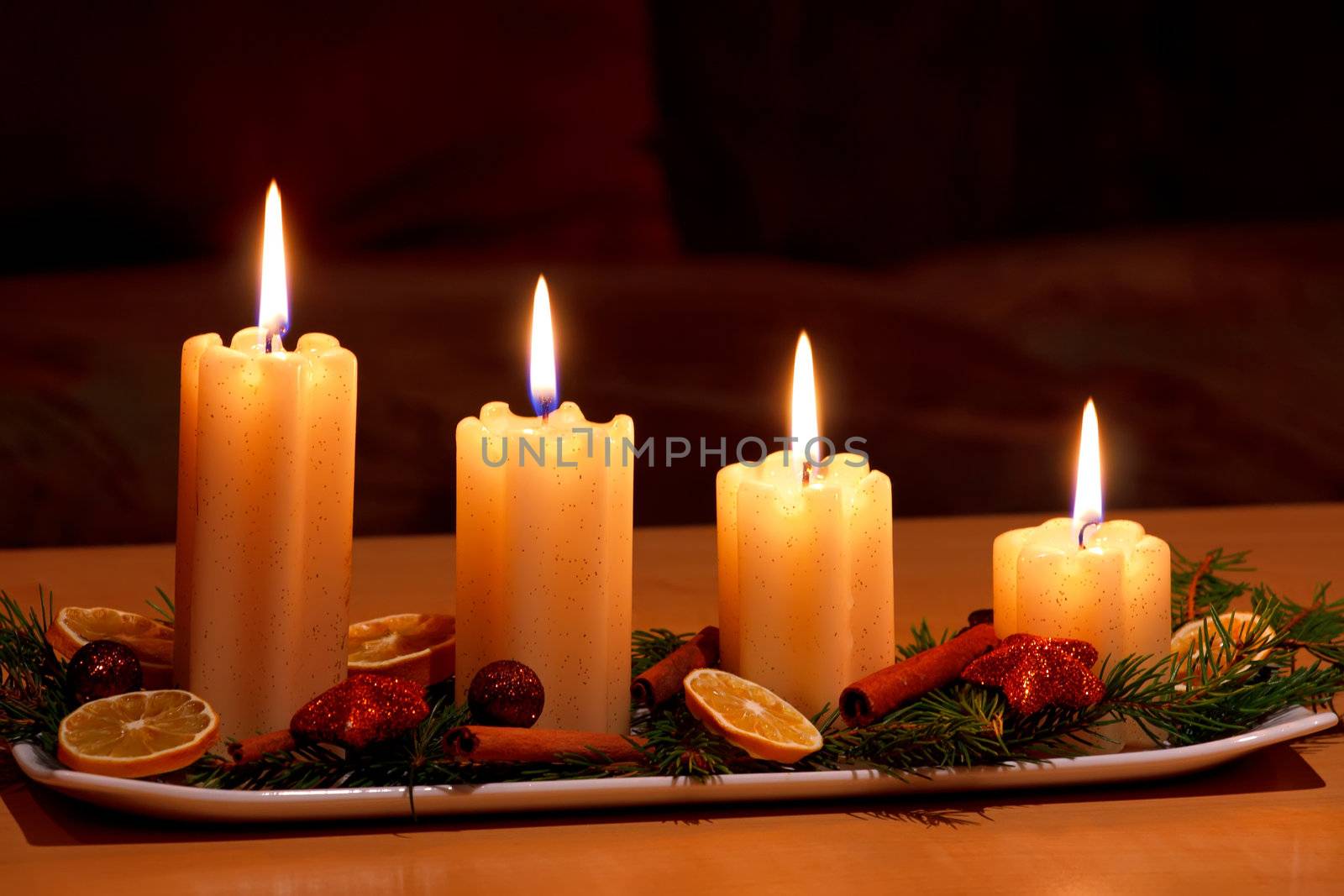 Christmas decorated table with lighting candles by artush