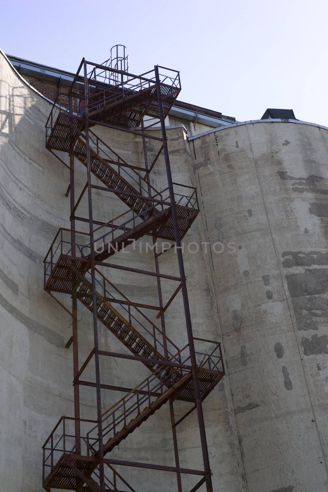 Staircase that extends up the side of a grain silo.