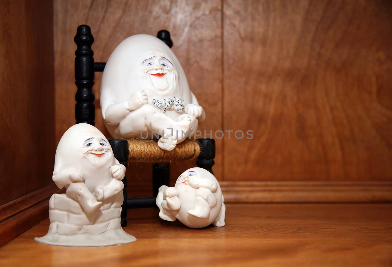 Cute little egg people sitting on a shelf