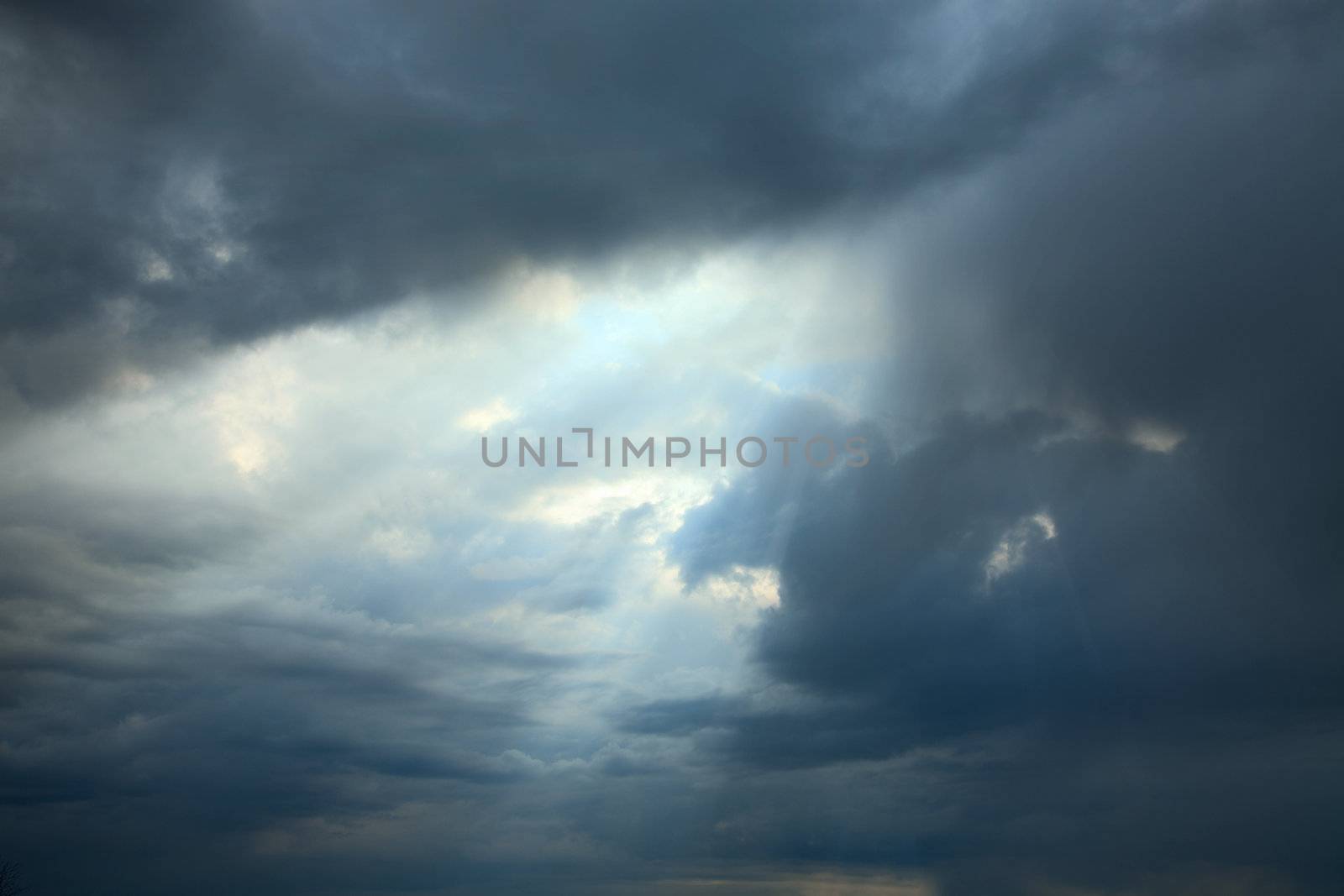 Sunshine making the way through dark clouds