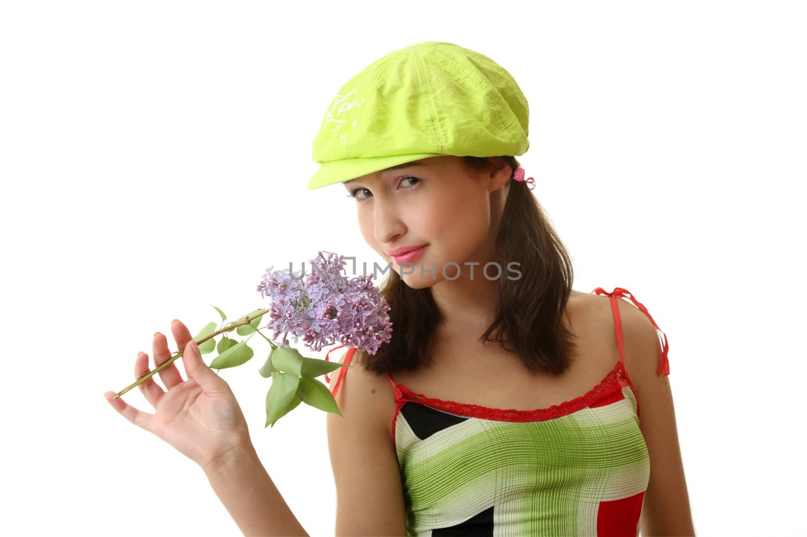 The girl in a green cap with a lilac bouquet