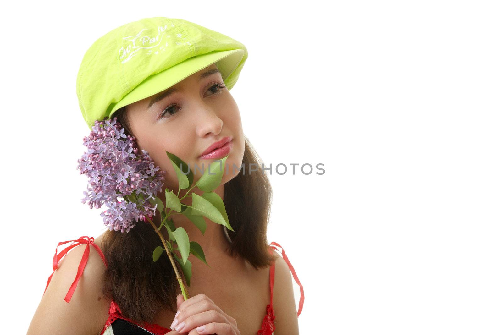 The girl in a green cap with a lilac bouquet