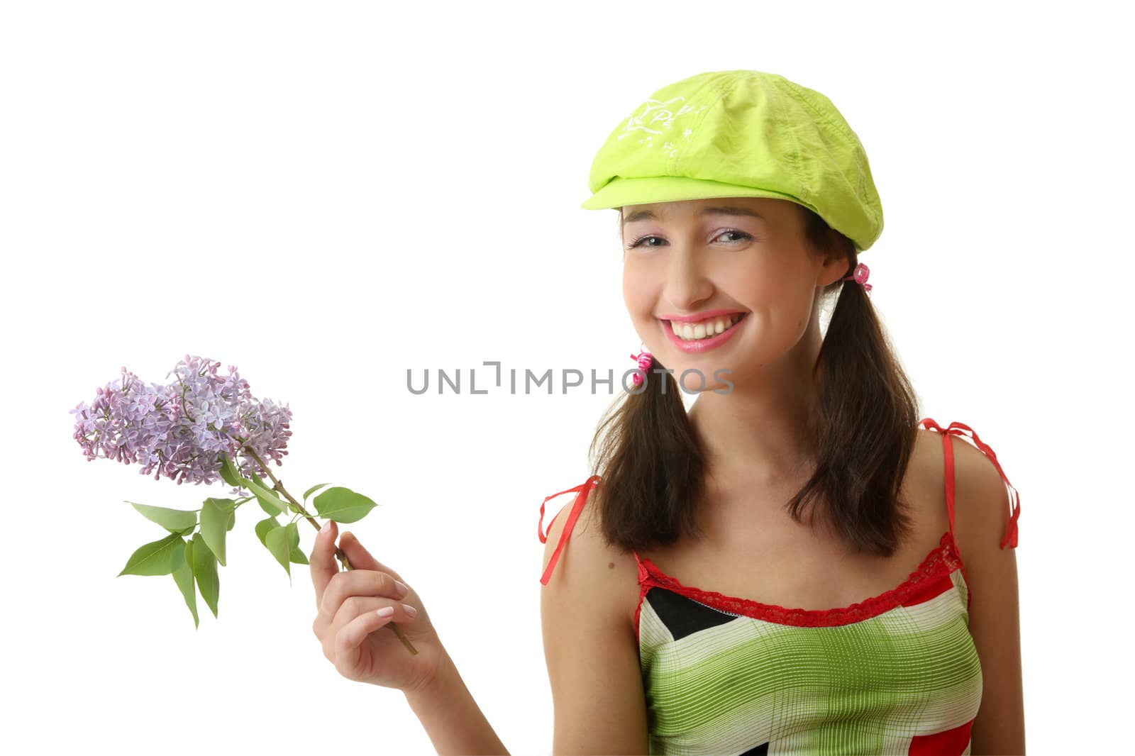 The girl in a green cap with a lilac bouquet